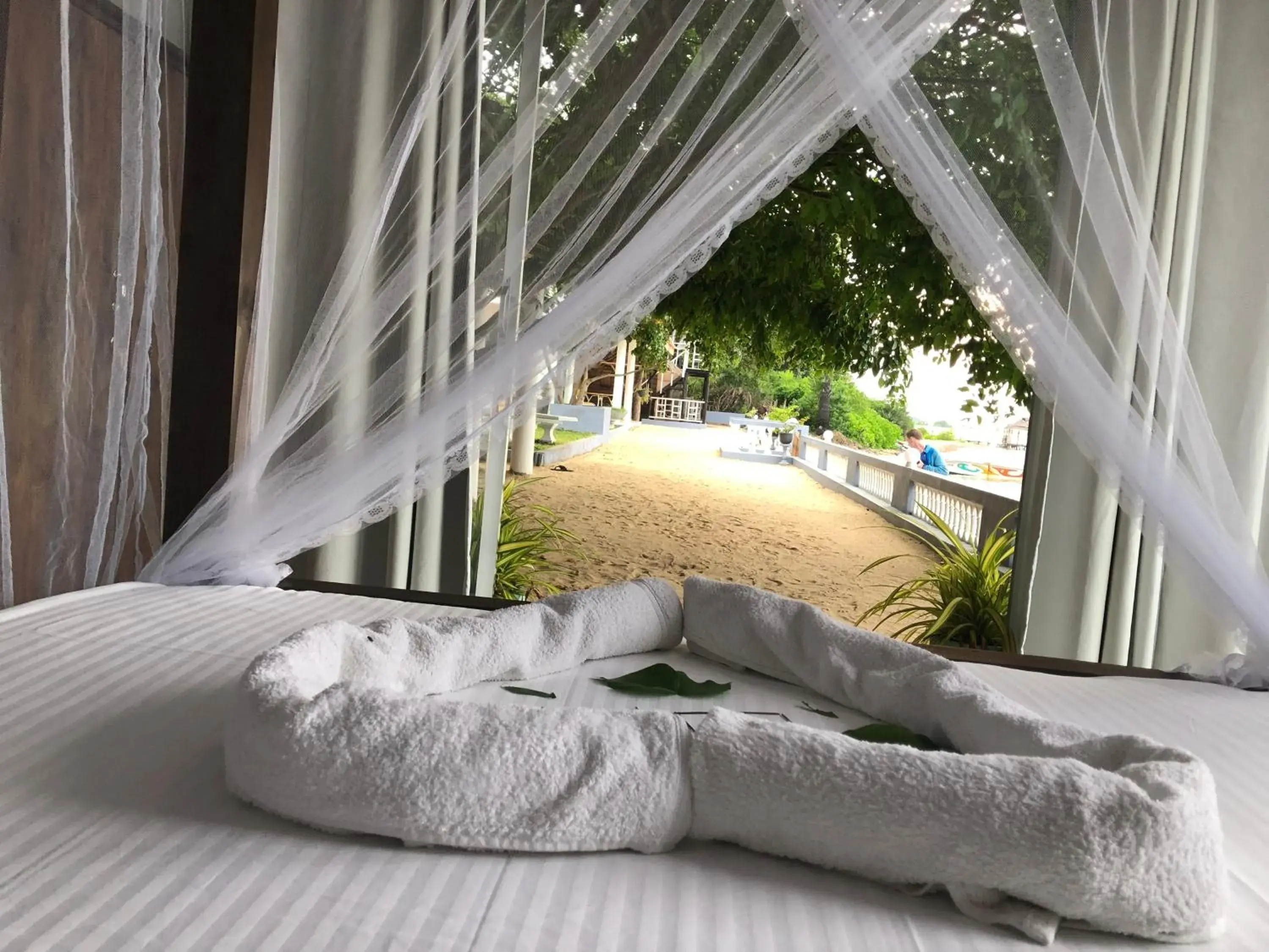 Property building, Bed in Dinuda Resort Property building, Bed in Dinuda Resort