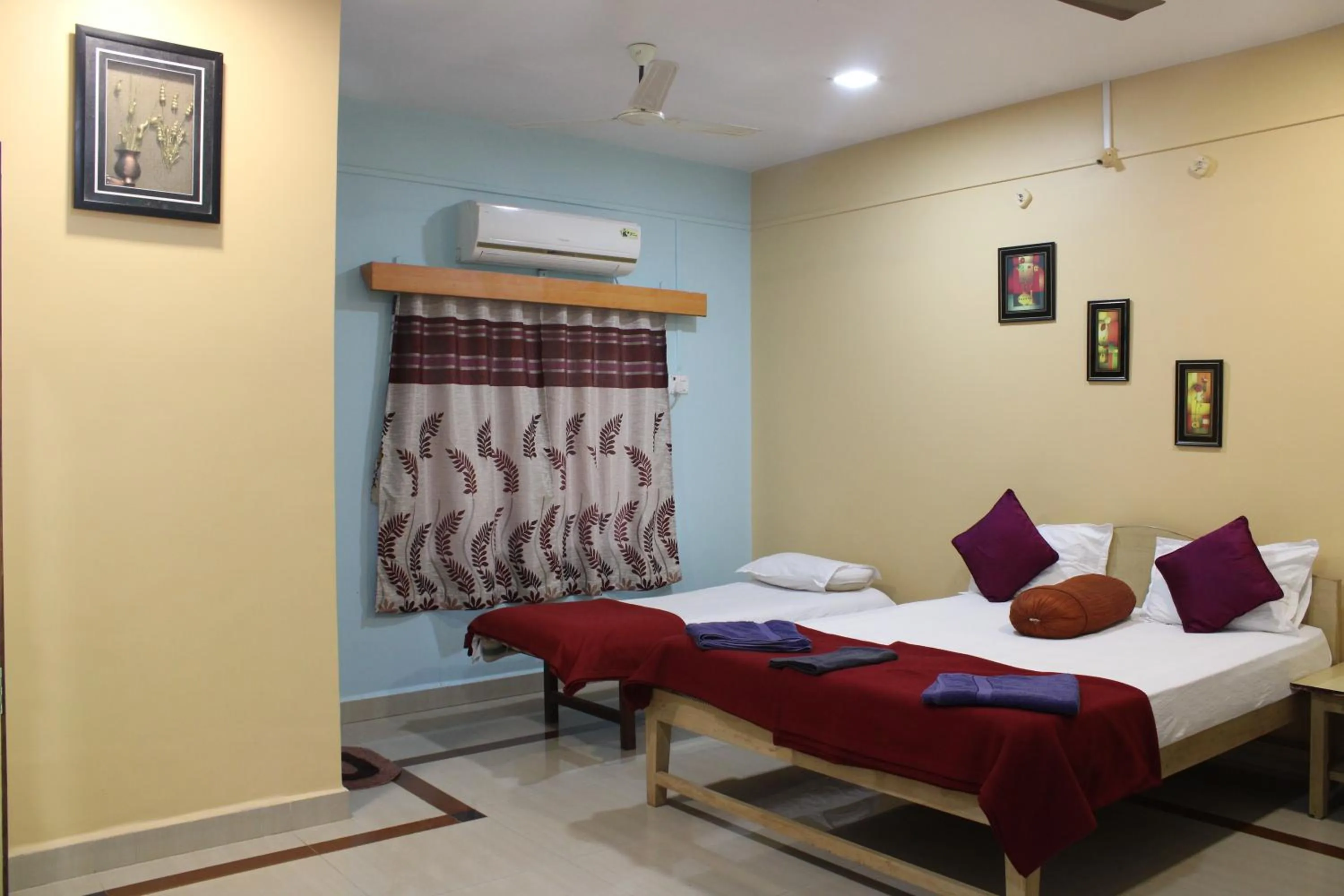 Bed in Nisarg Resort