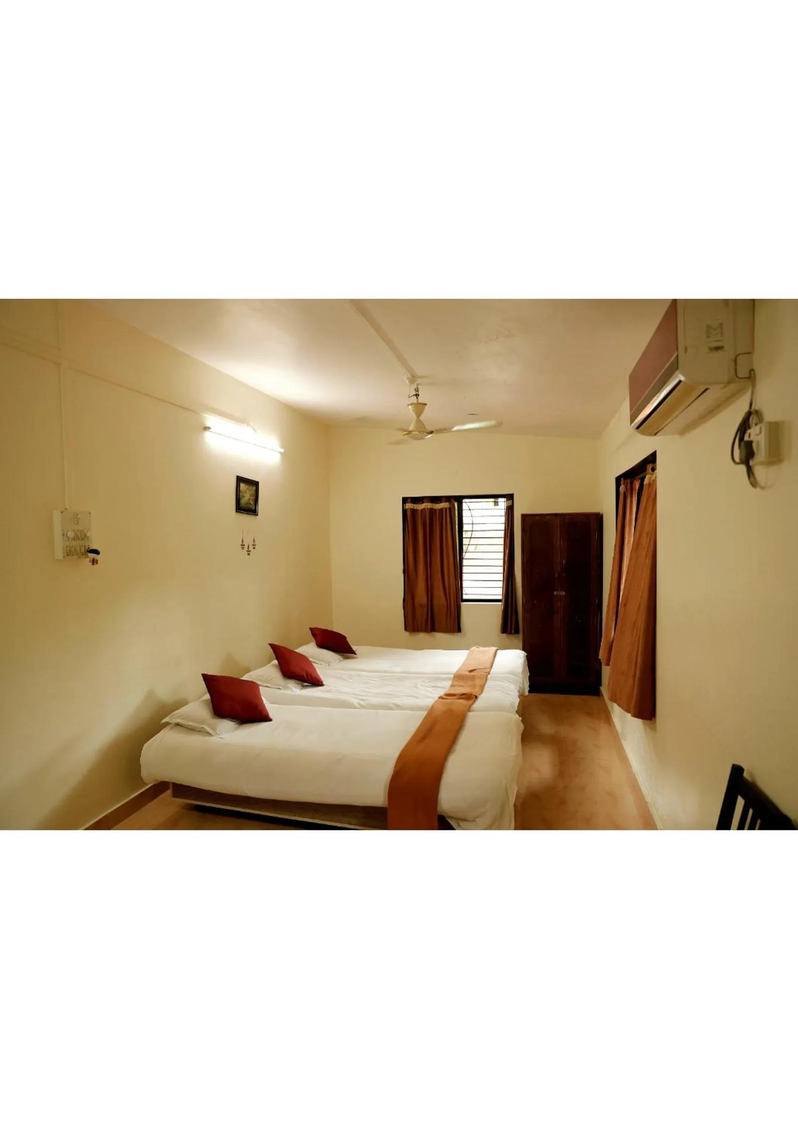 Bed in Nisarg Resort