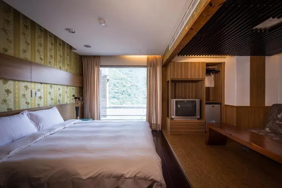 Bed in WULAI SungLyu Spring Resort