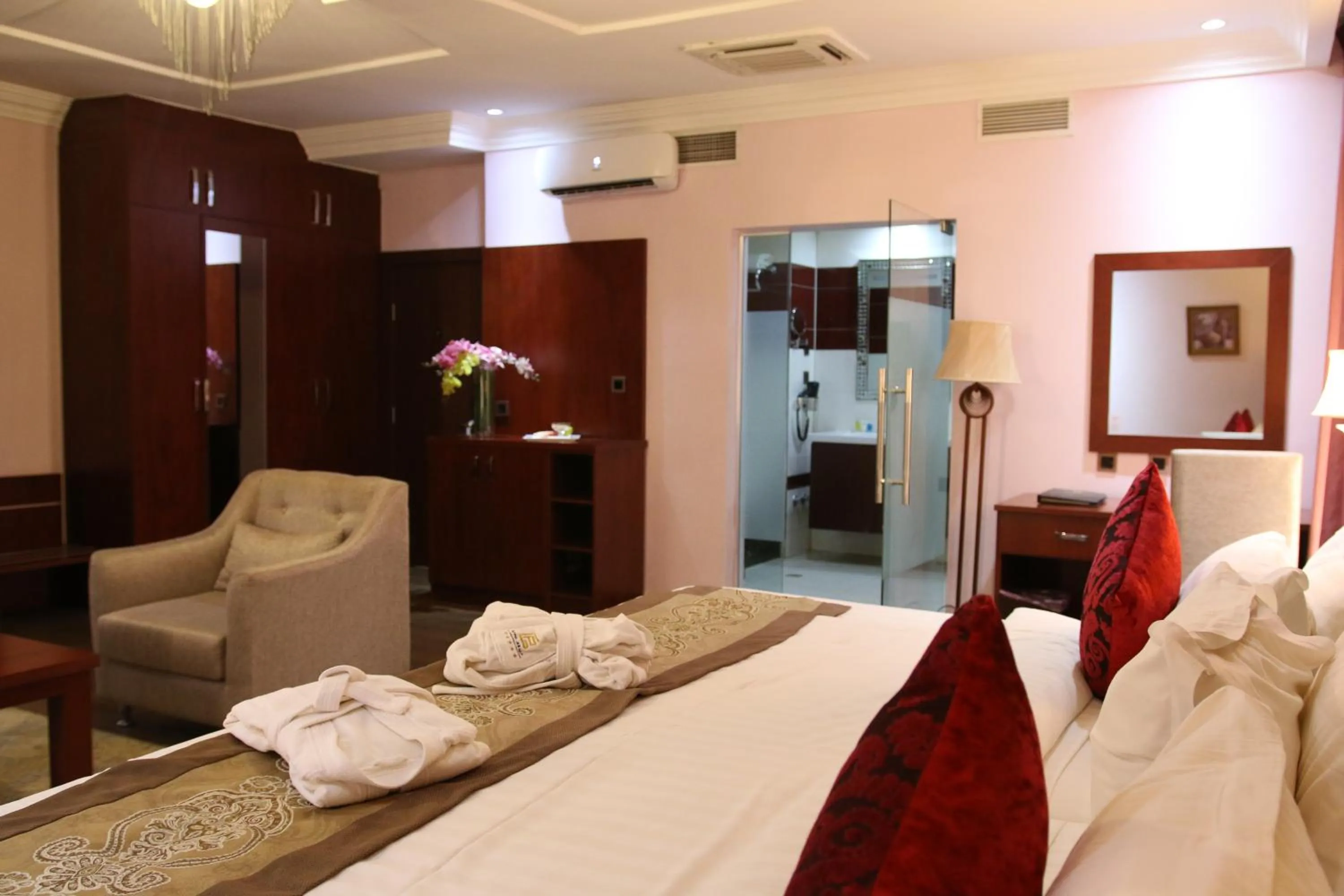 Bed in Grand Pela Hotel & Suites