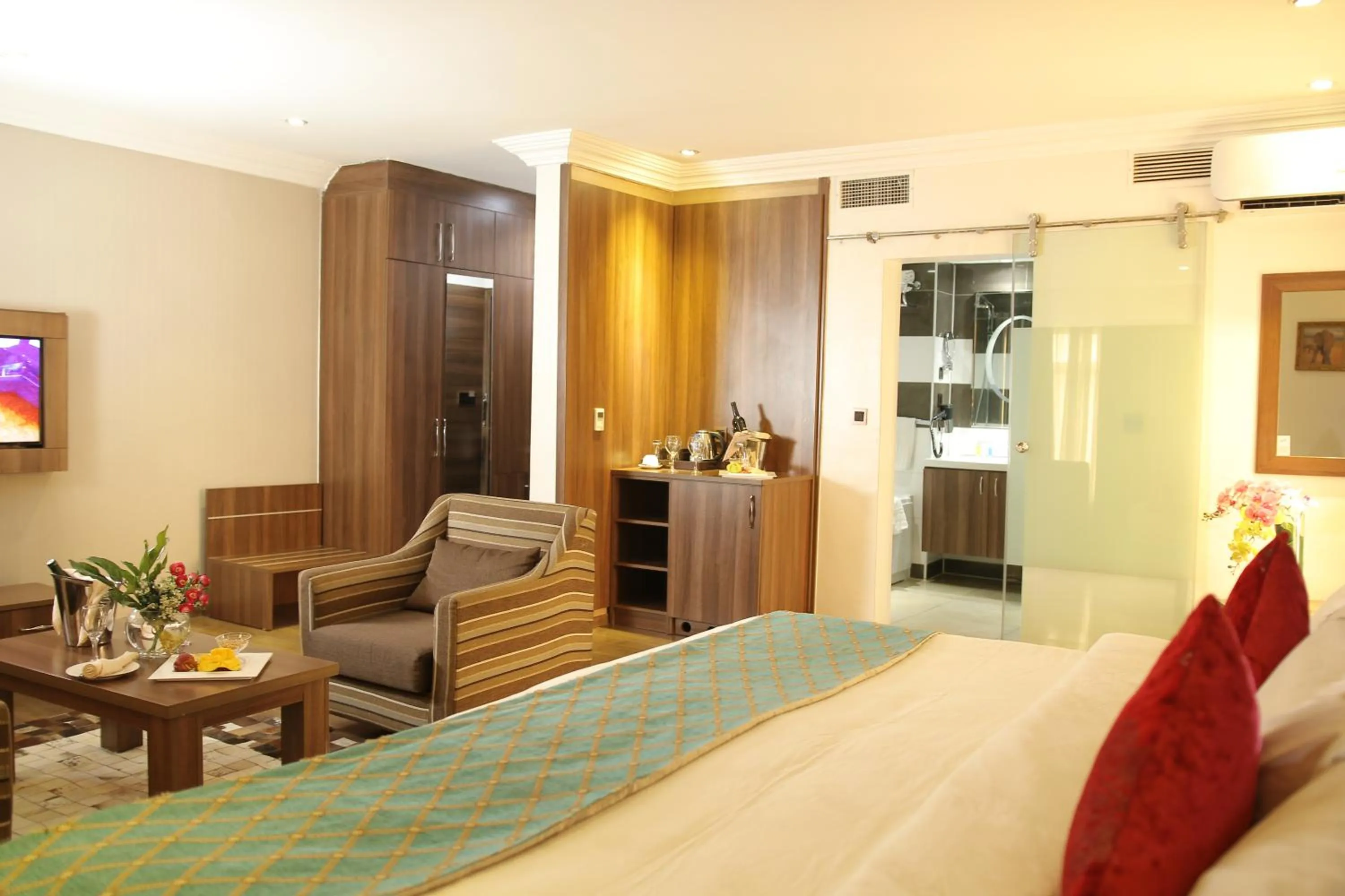 Bed in Grand Pela Hotel & Suites