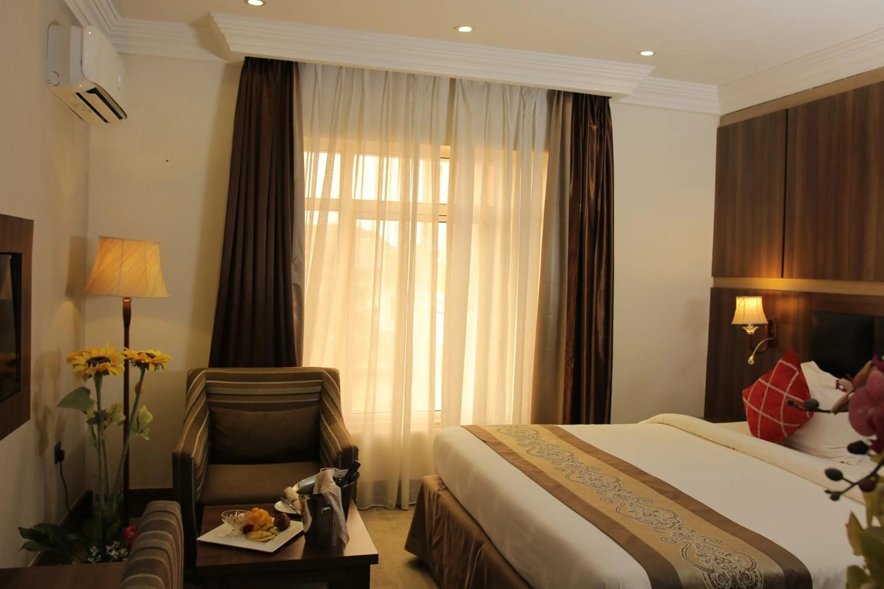 Bed in Grand Pela Hotel & Suites