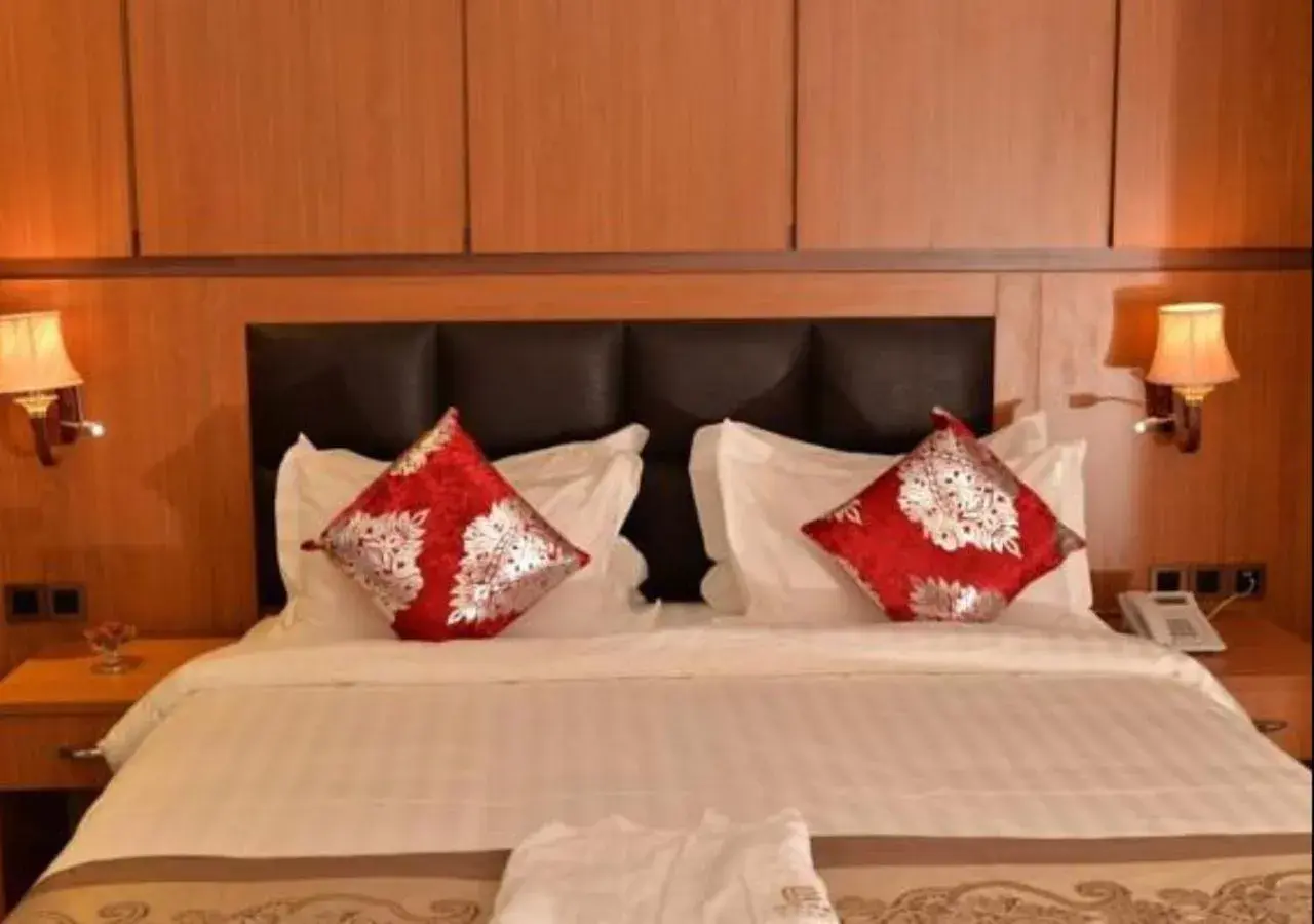 Bed in Grand Pela Hotel & Suites Bed in Grand Pela Hotel & Suites