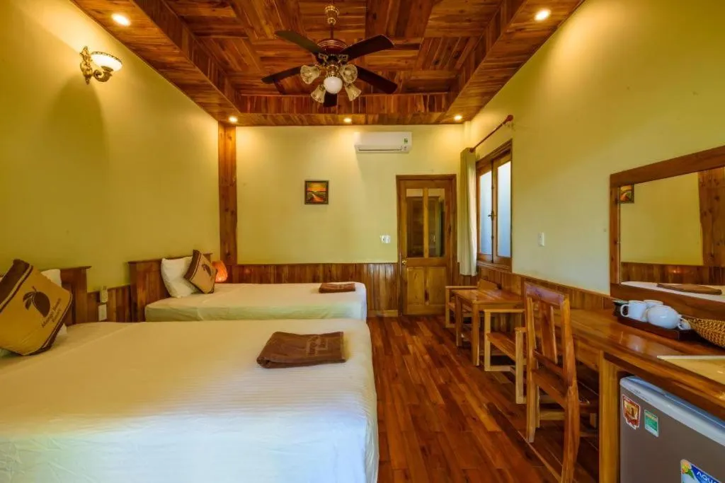 Bed in Mango Beach Resort