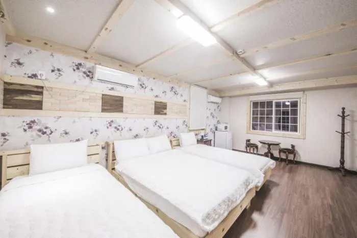 Bed in Red Windmill Pension