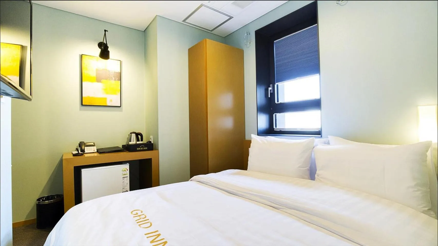 Bed in Grid Inn Hotel