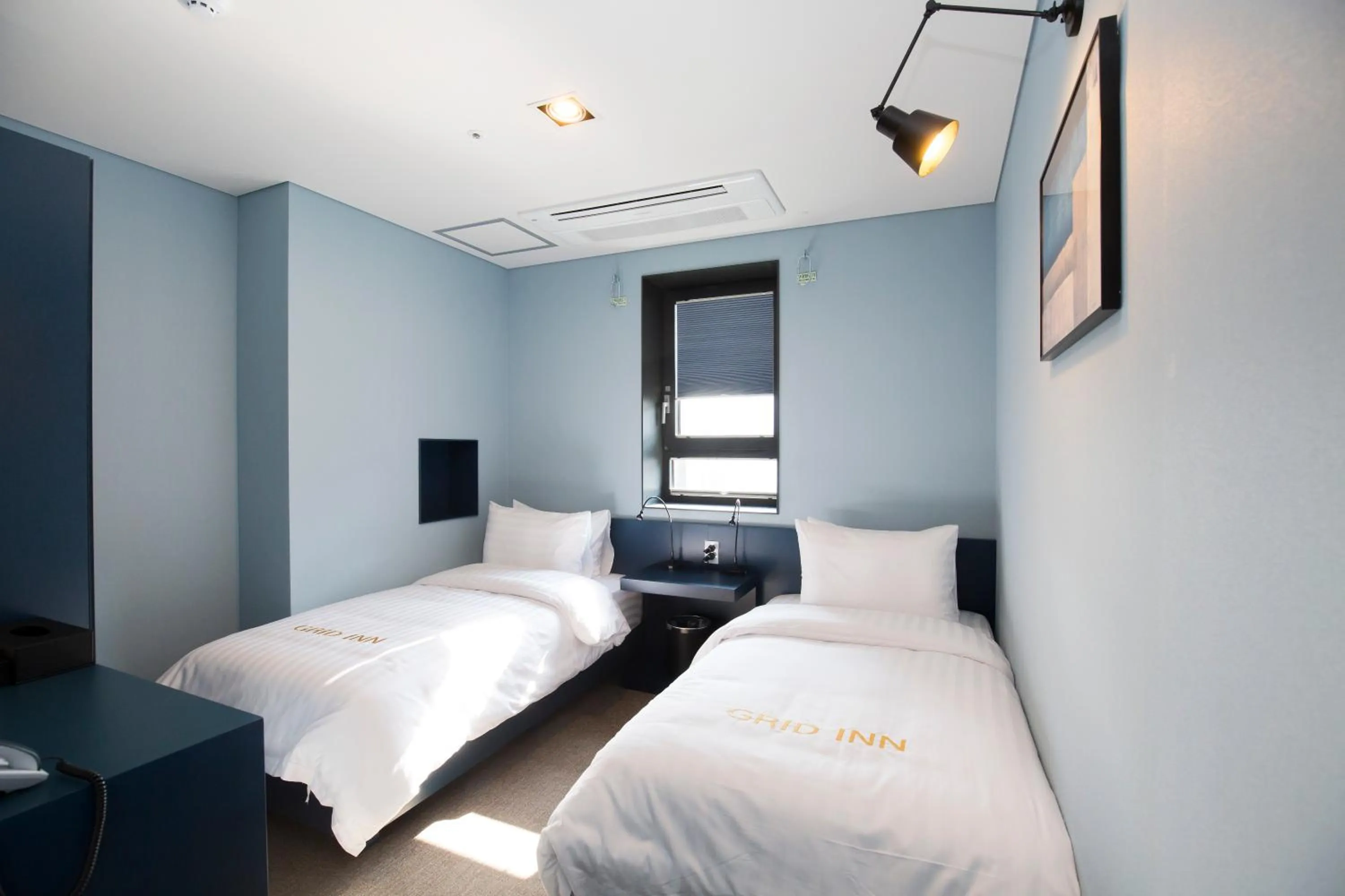 Decorative detail, Bed in Grid Inn Hotel