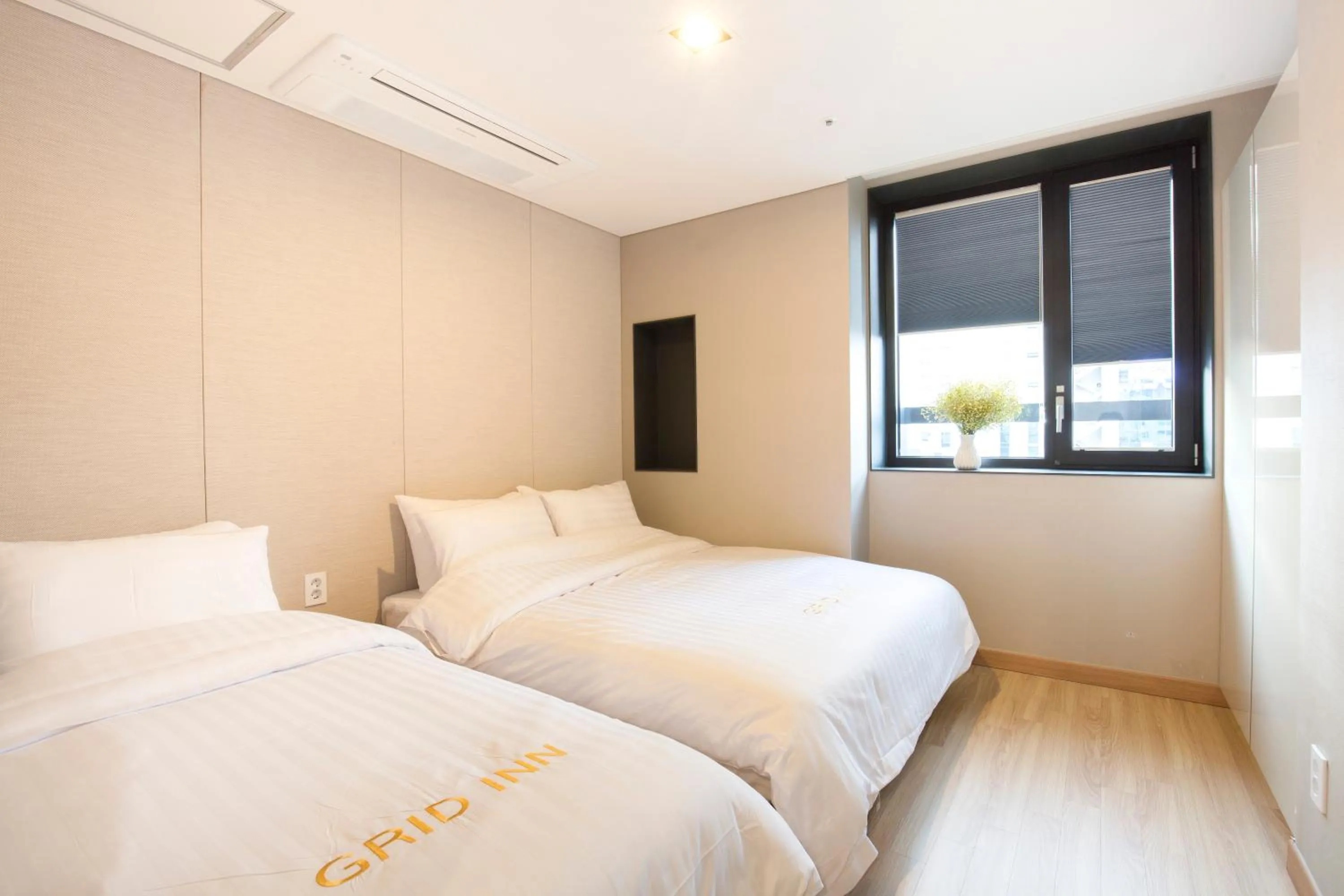 Decorative detail, Bed in Grid Inn Hotel