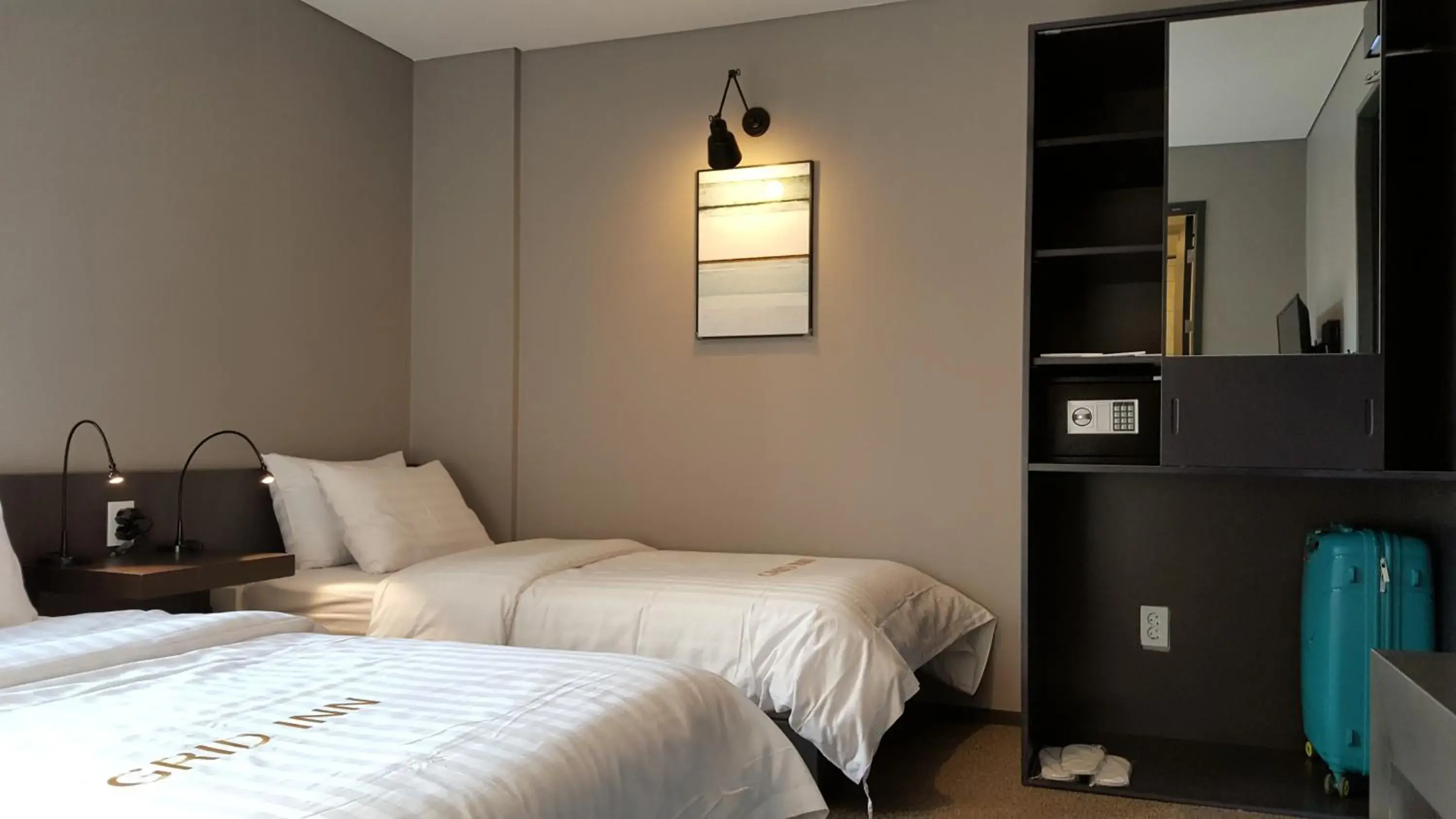 Decorative detail, Bed in Grid Inn Hotel Decorative detail, Bed in Grid Inn Hotel