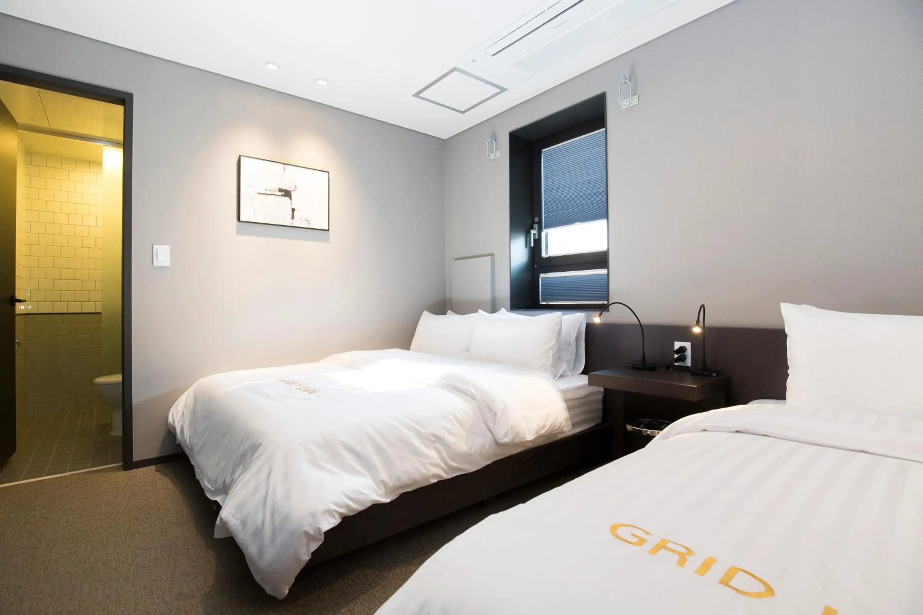 Decorative detail, Bed in Grid Inn Hotel