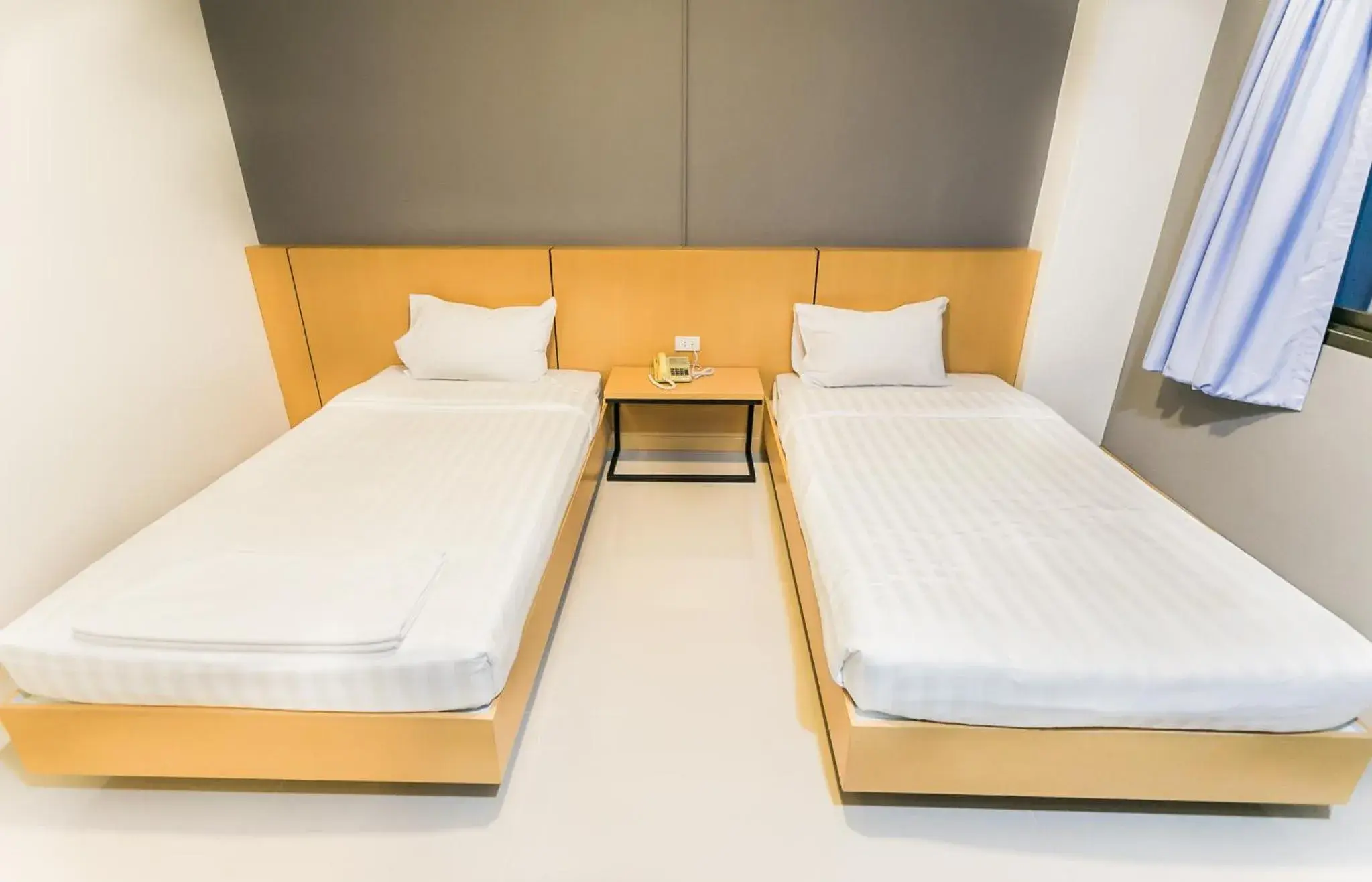 Bed in Grand Leo Hotel Bed in Grand Leo Hotel