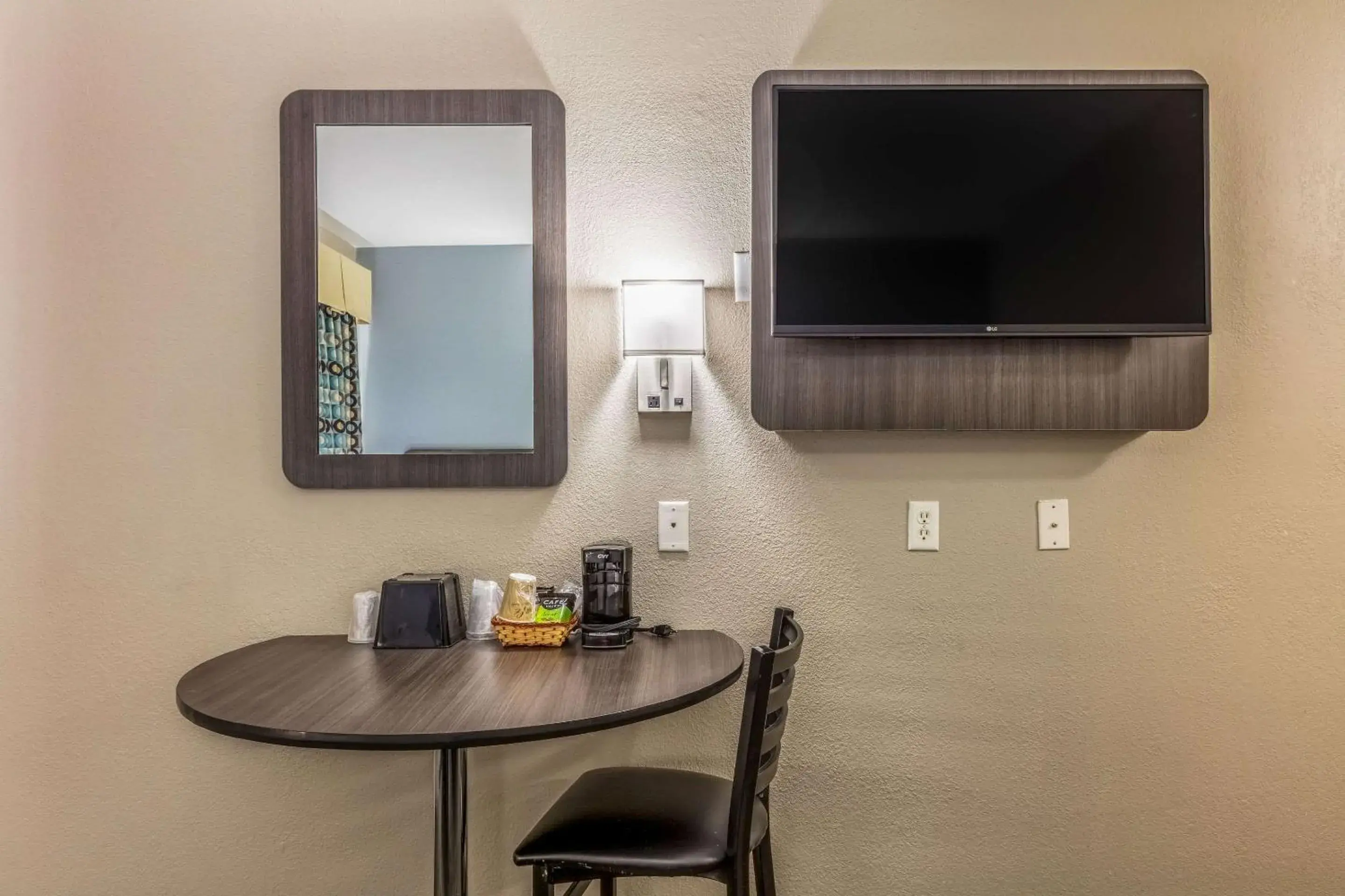 Photo of the whole room, TV/Entertainment Center in Econo Lodge