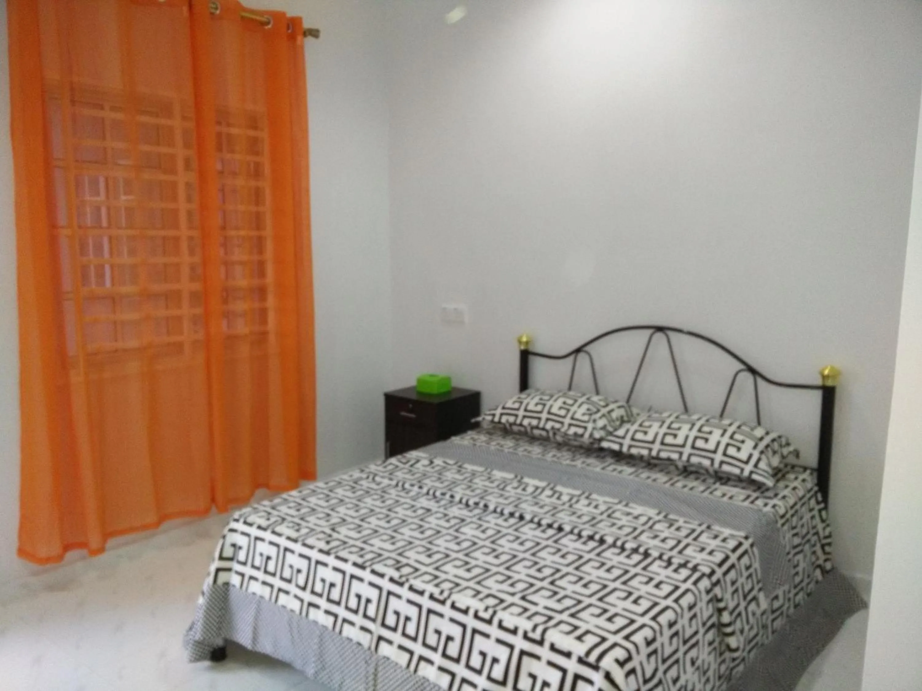 Bed in Mama Iman Guestroom