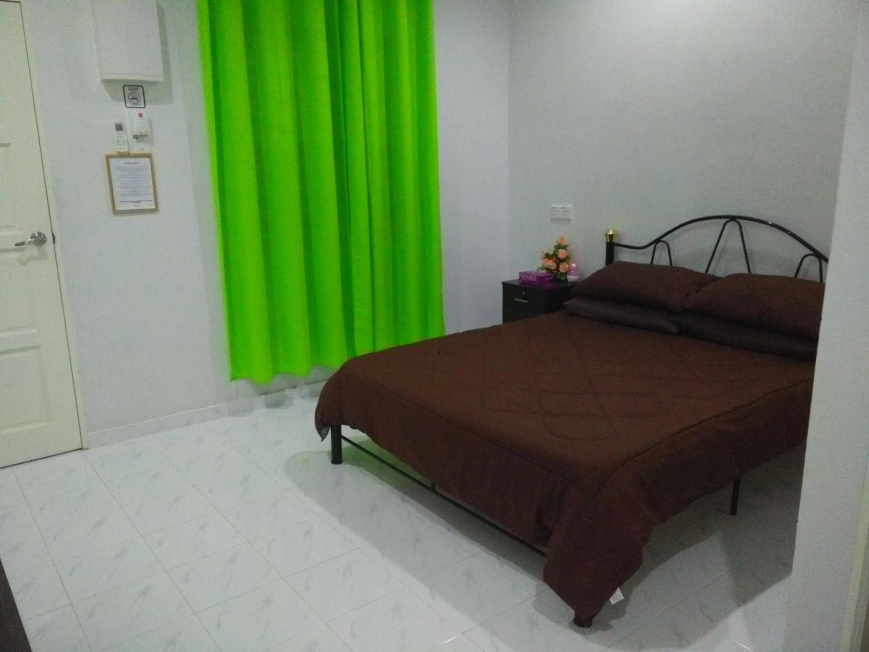 Bed in Mama Iman Guestroom