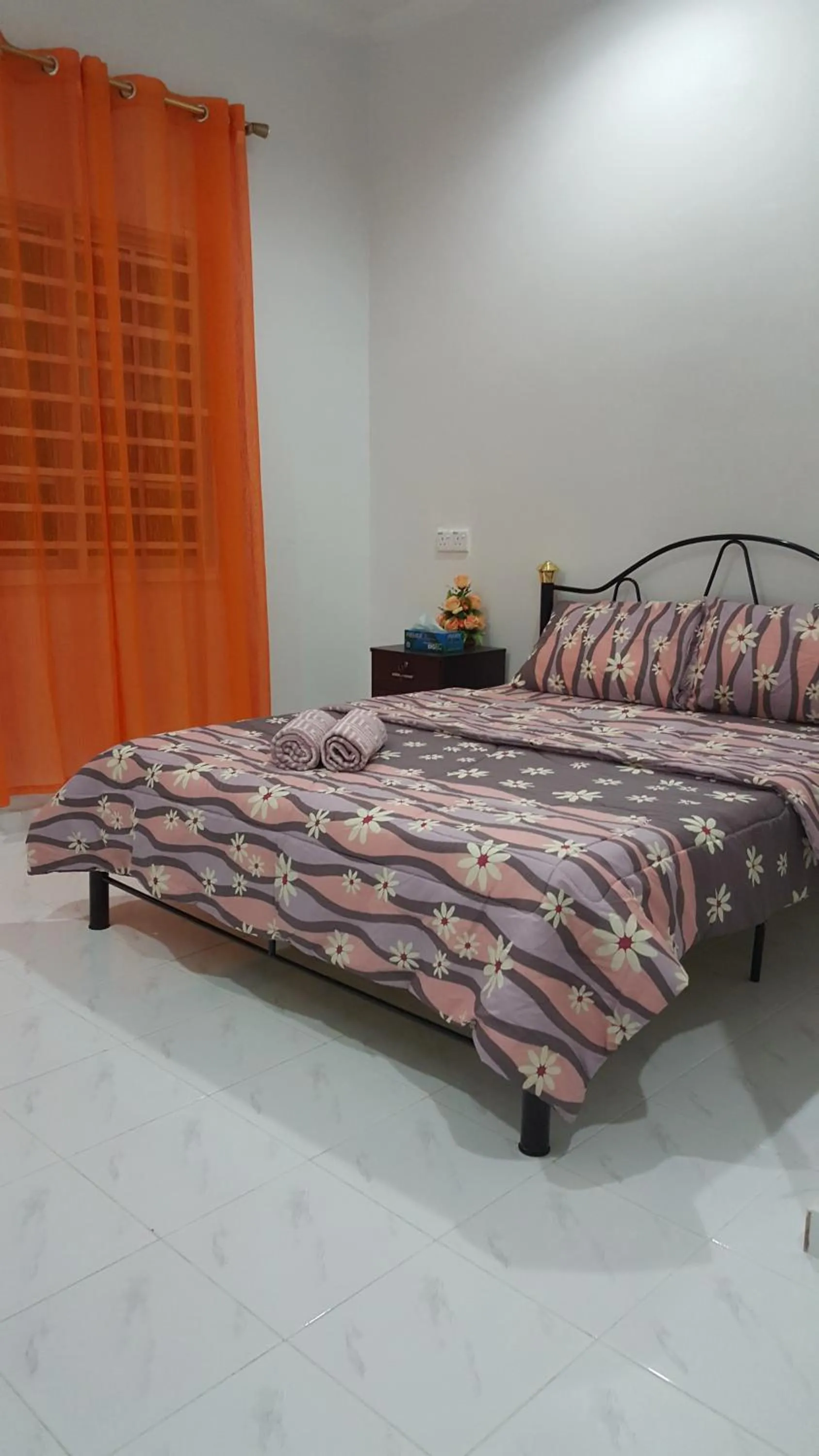 Bed in Mama Iman Guestroom