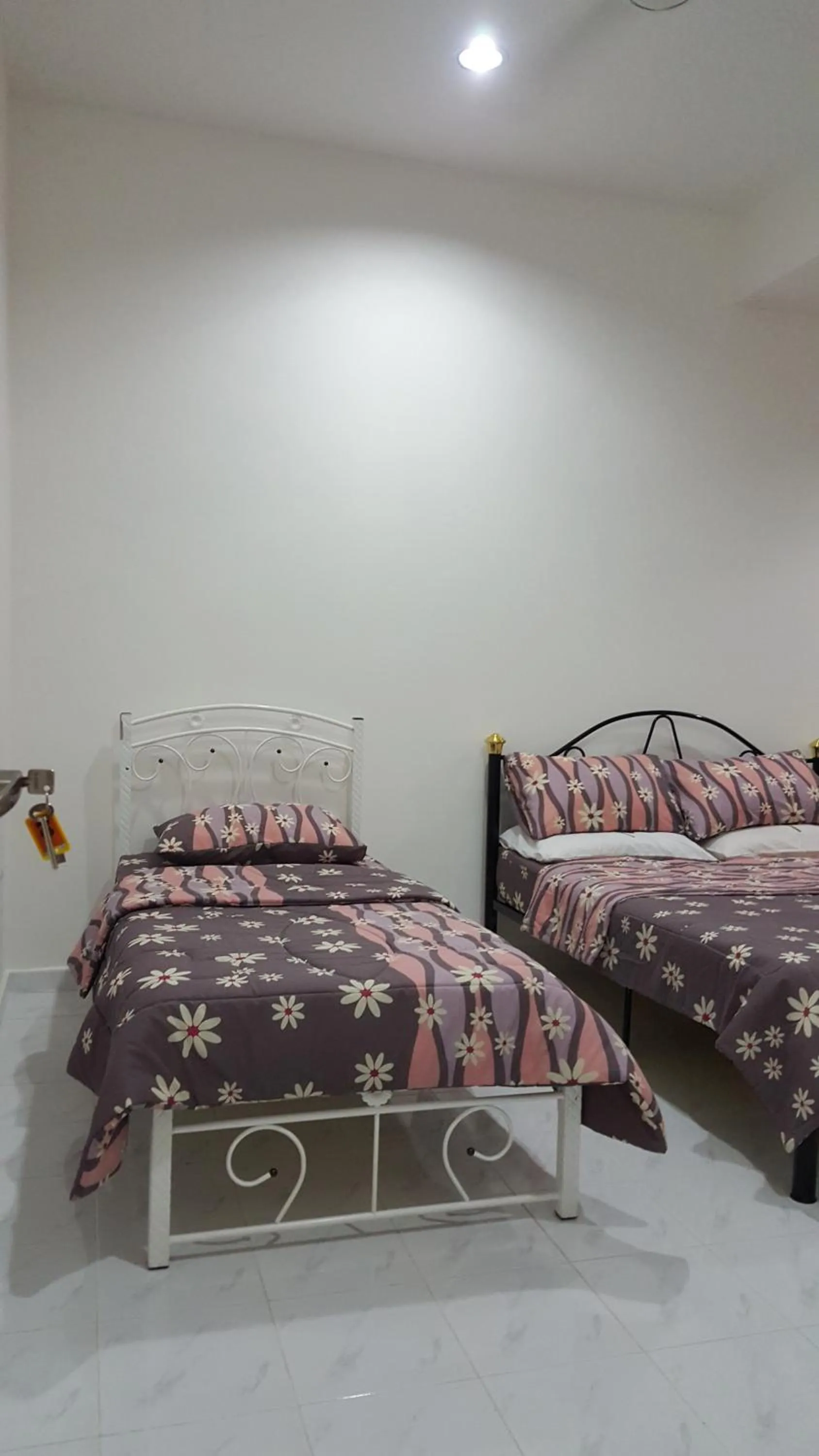 Bed in Mama Iman Guestroom