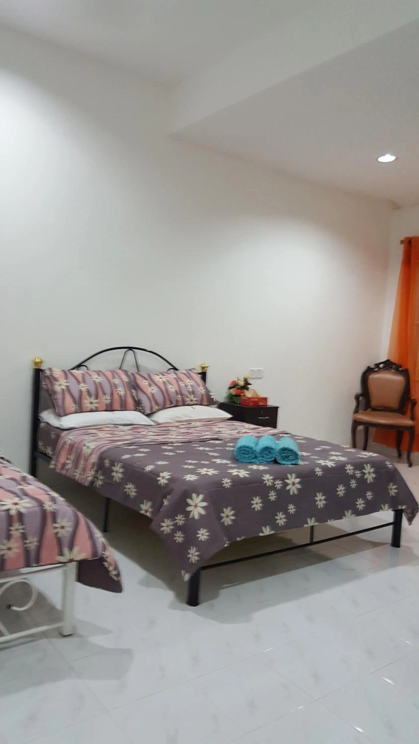 Bed in Mama Iman Guestroom