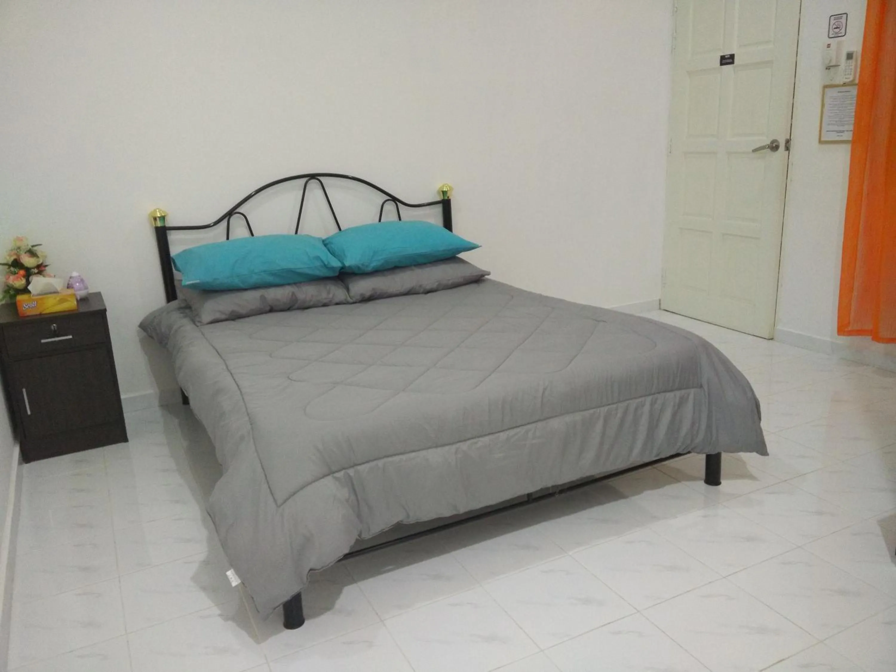 Bed in Mama Iman Guestroom