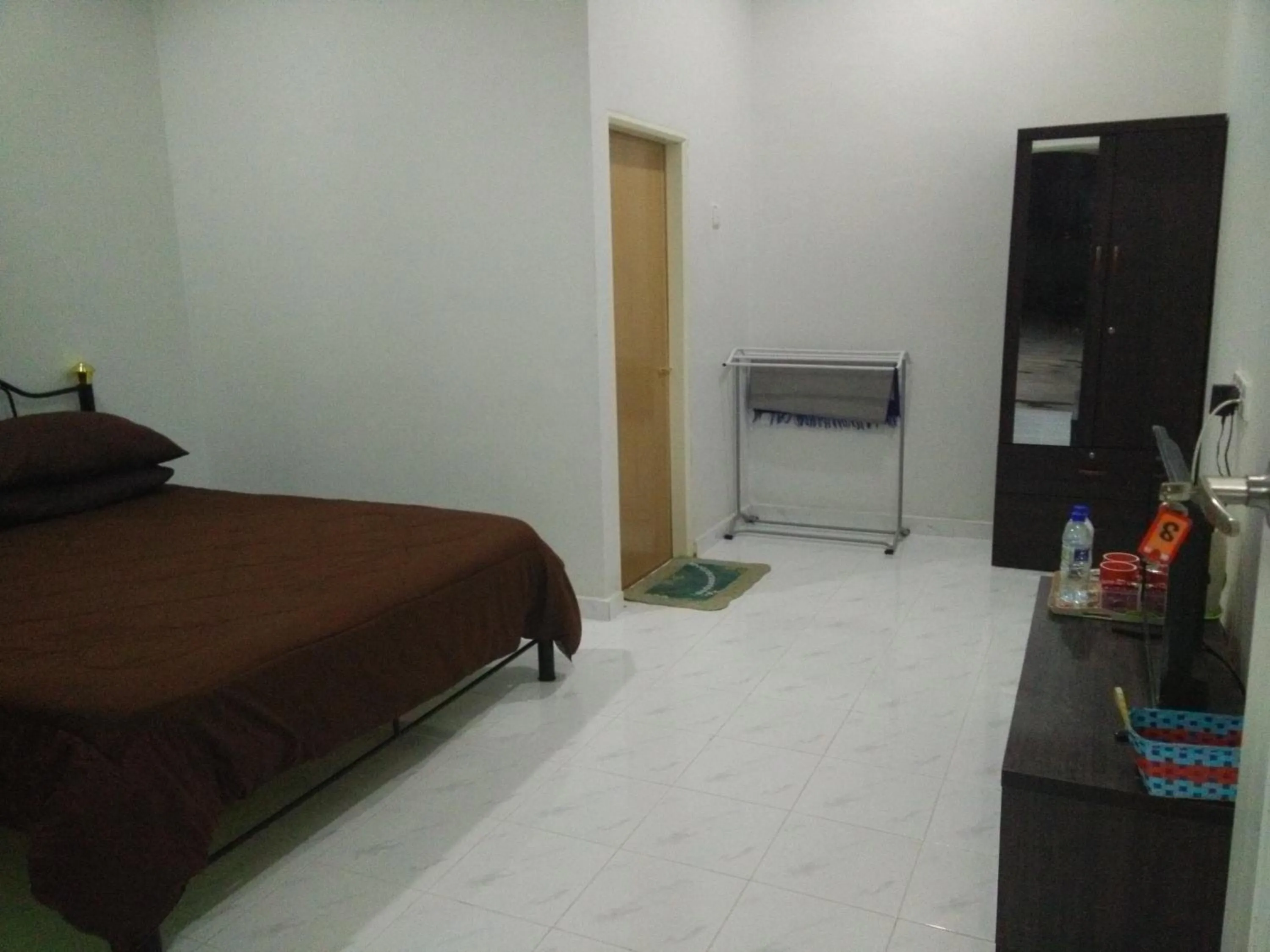 Bed in Mama Iman Guestroom