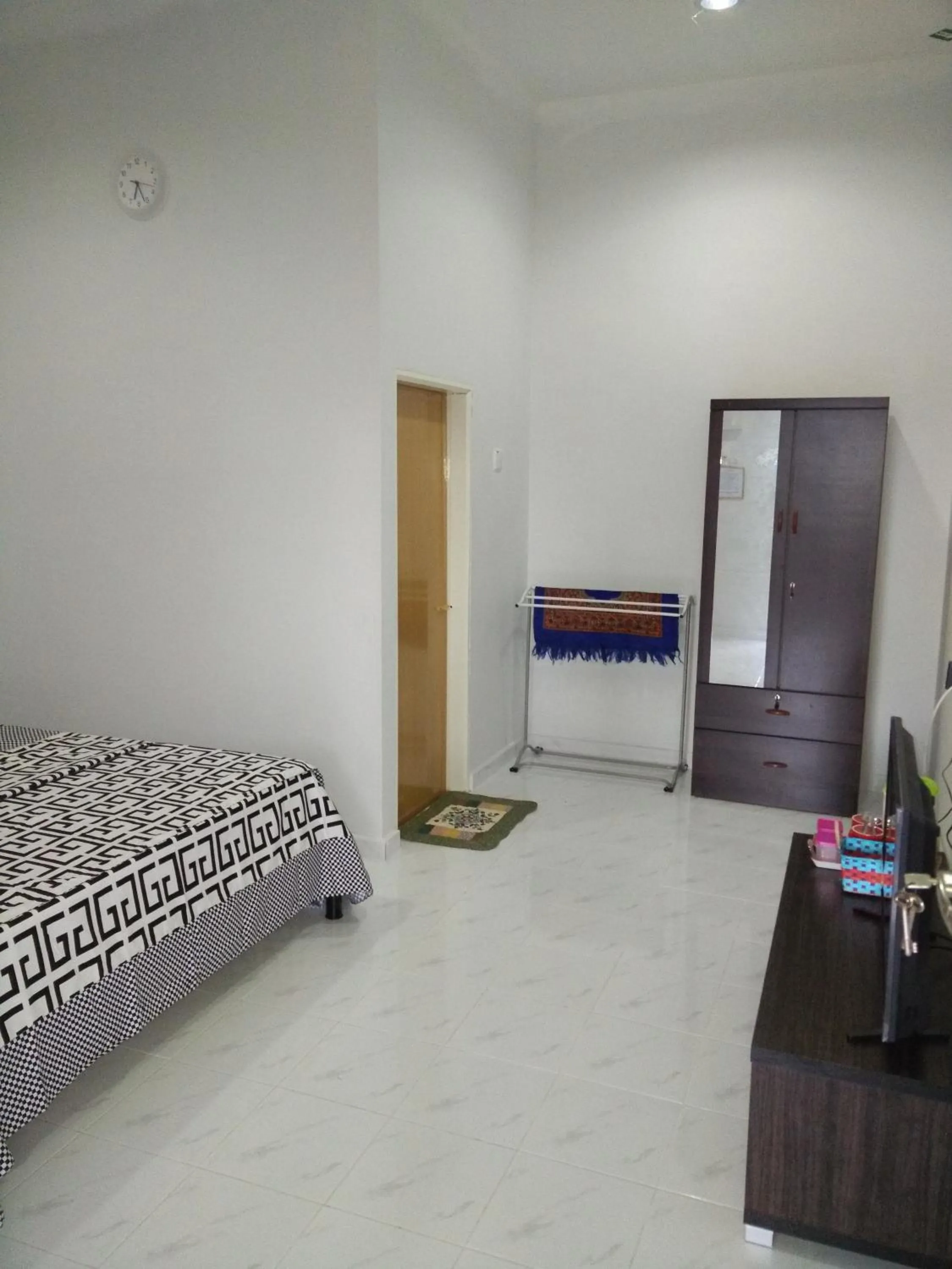 Bed in Mama Iman Guestroom