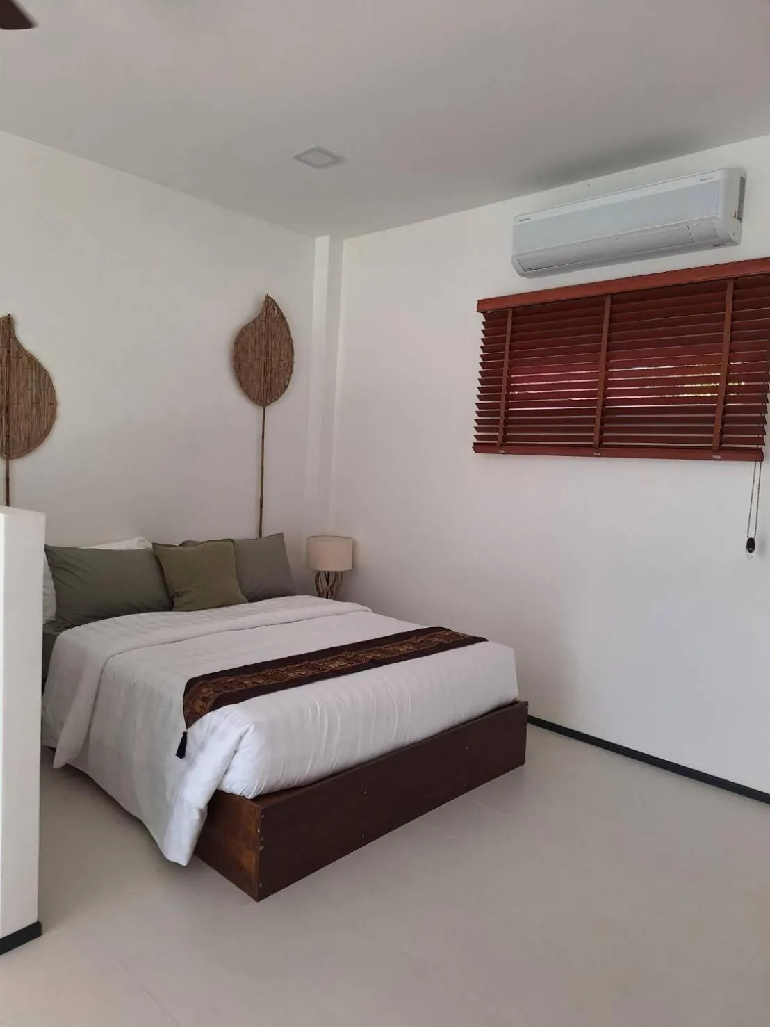 Bed in Lotus Bleu Resort & Restaurant