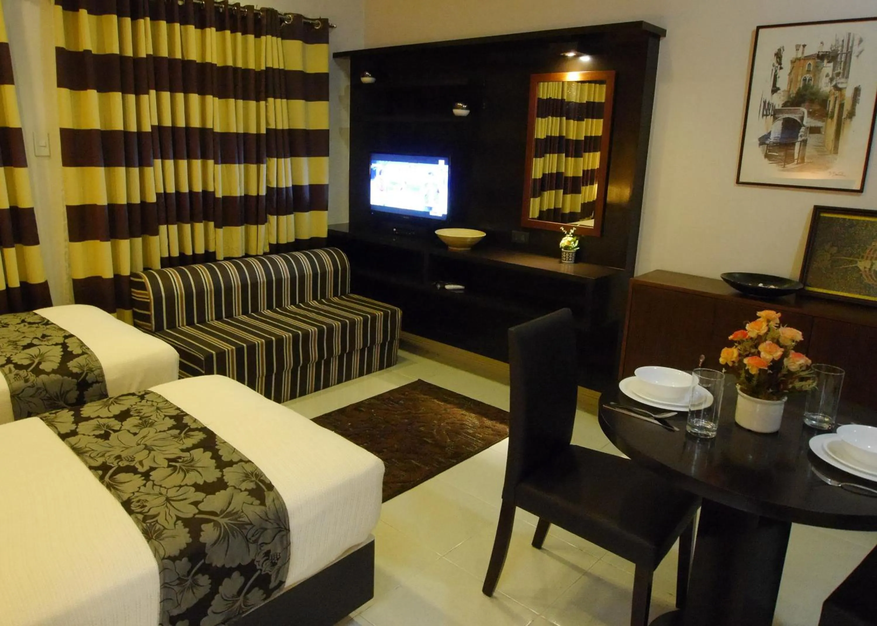 Photo of the whole room, Bed in New Manila Suites