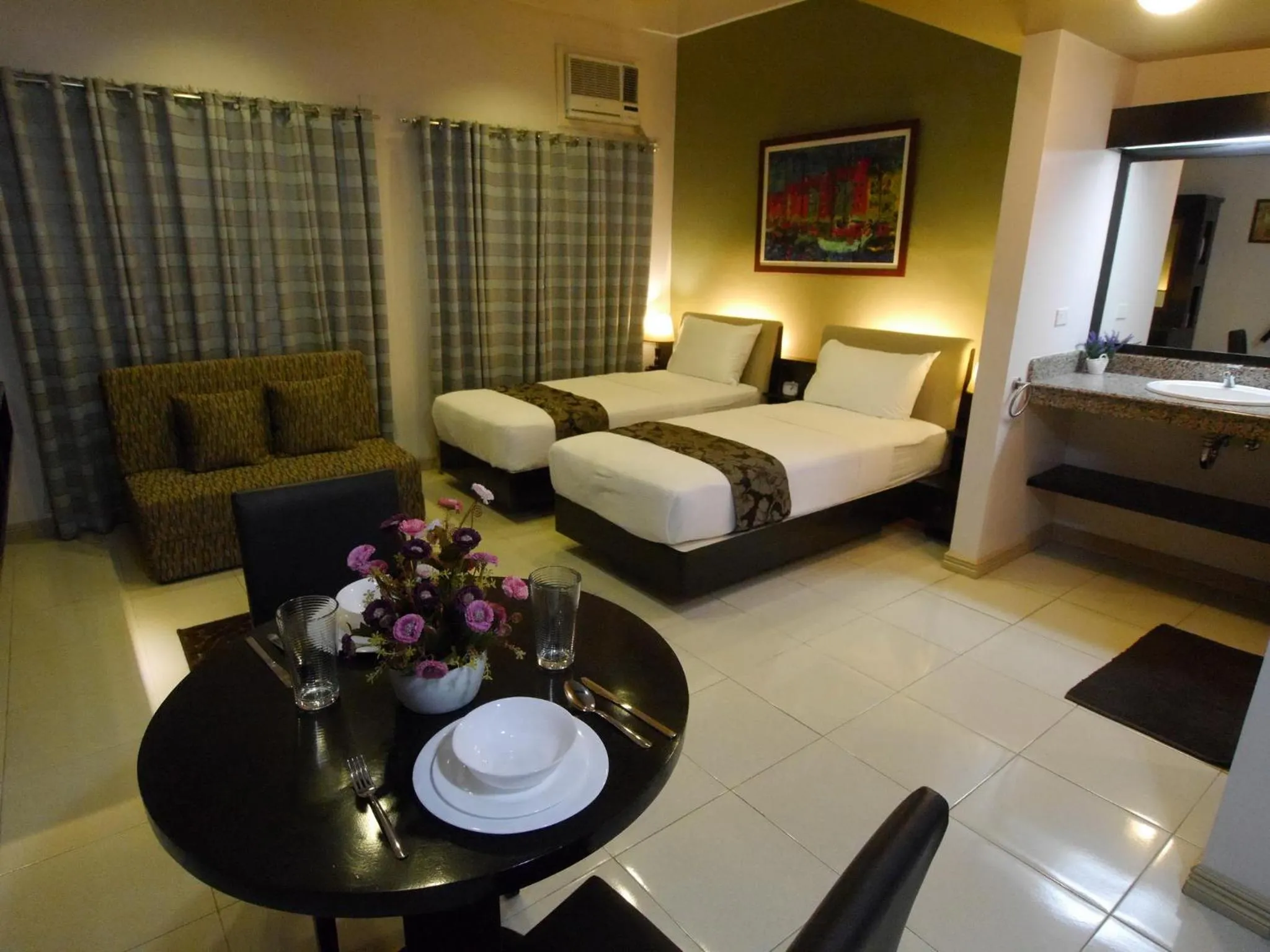 Photo of the whole room, Bed in New Manila Suites