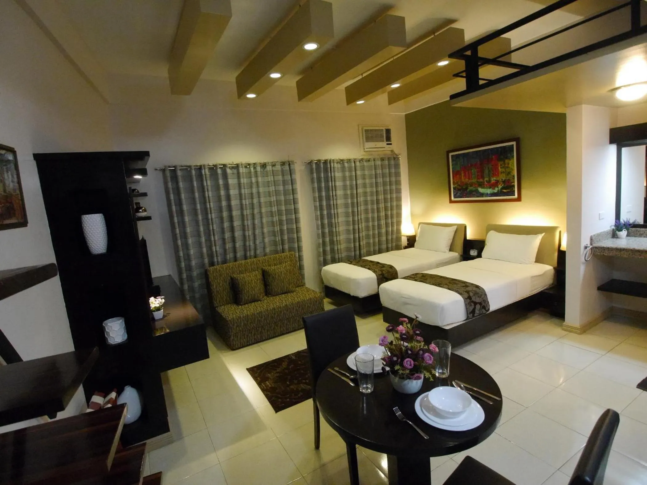 Photo of the whole room, Bed in New Manila Suites