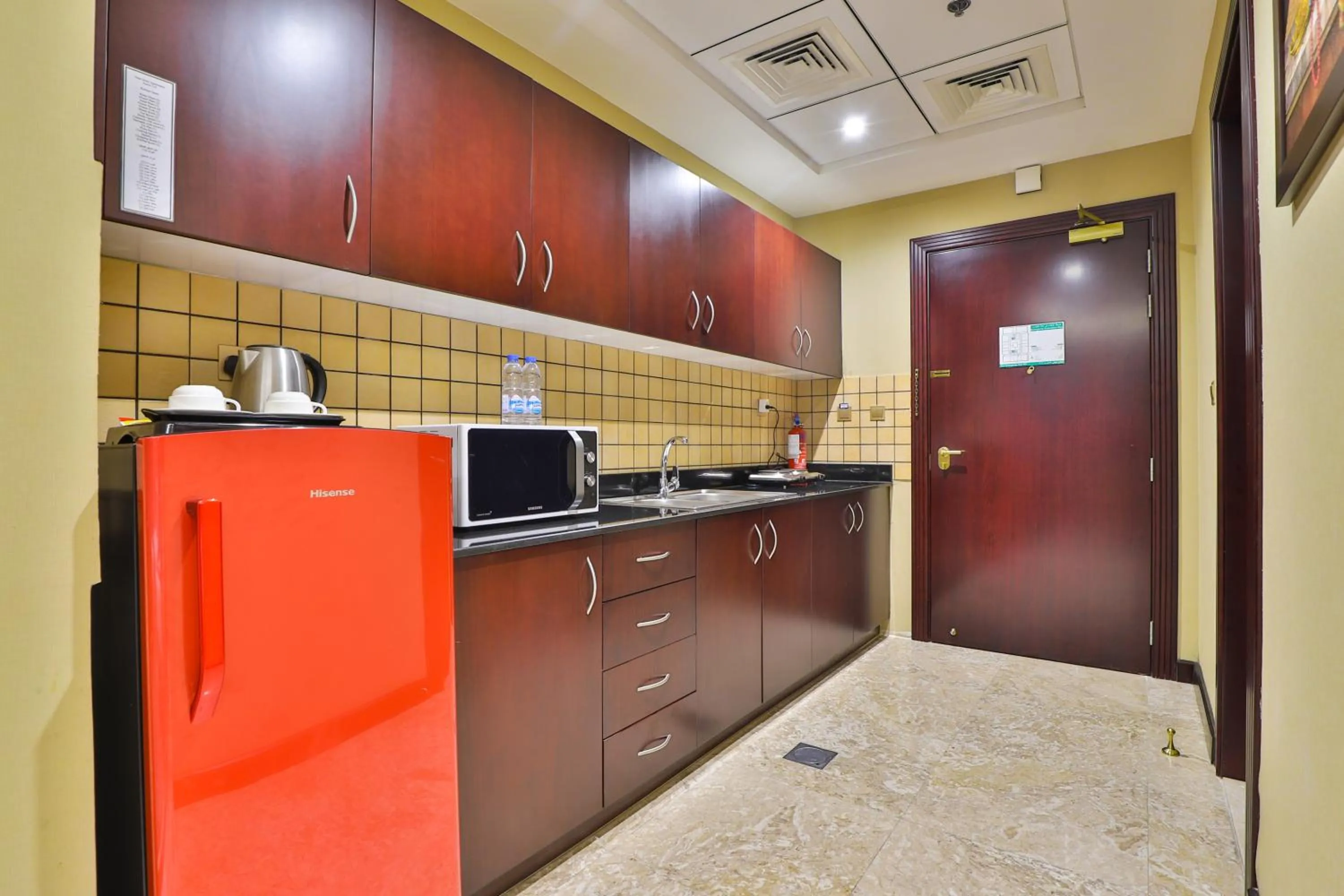 Kitchen or kitchenette in Telal Hotel Apartments