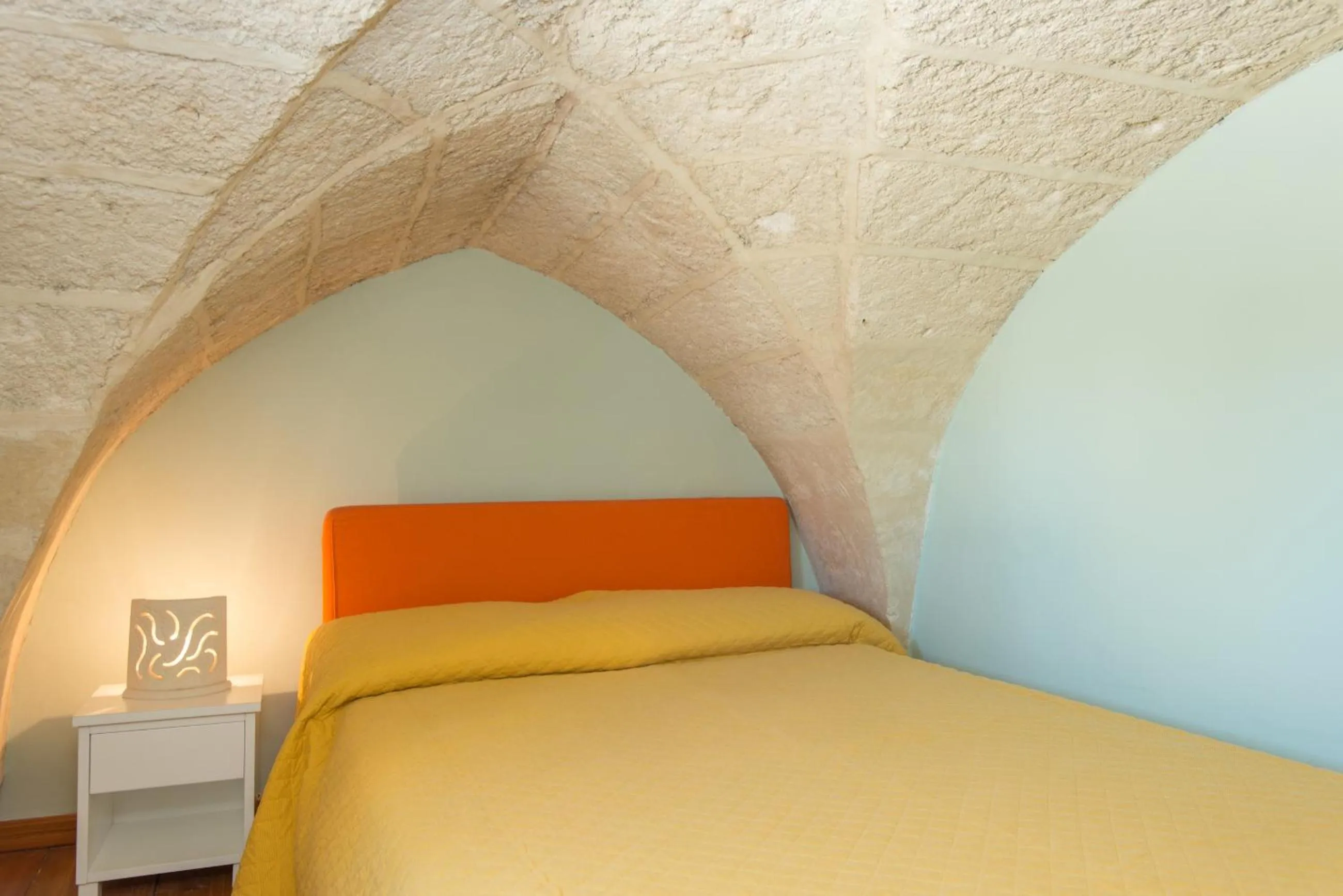 Bed in Il Garbino Suite and Apartment