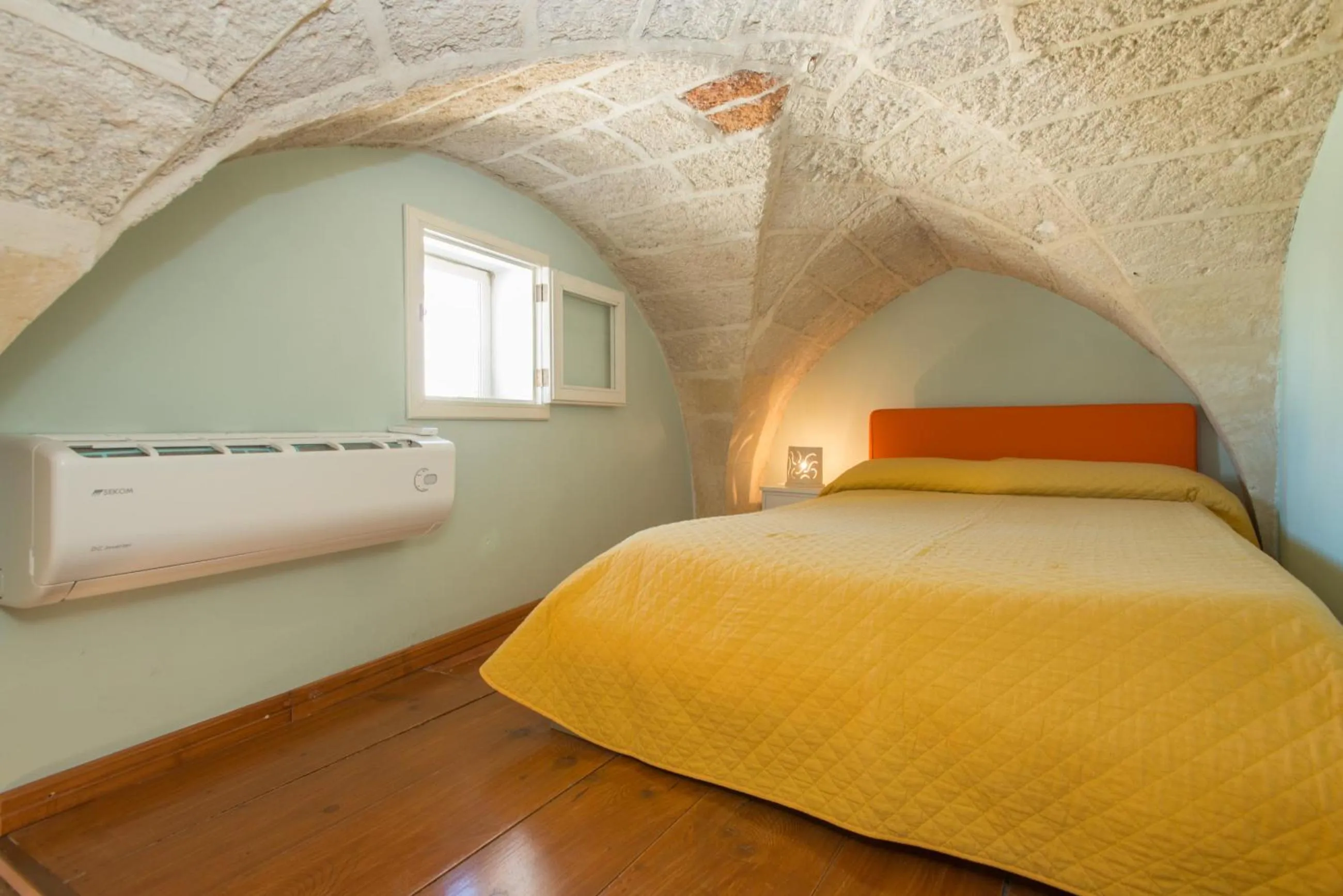 Bed in Il Garbino Suite and Apartment