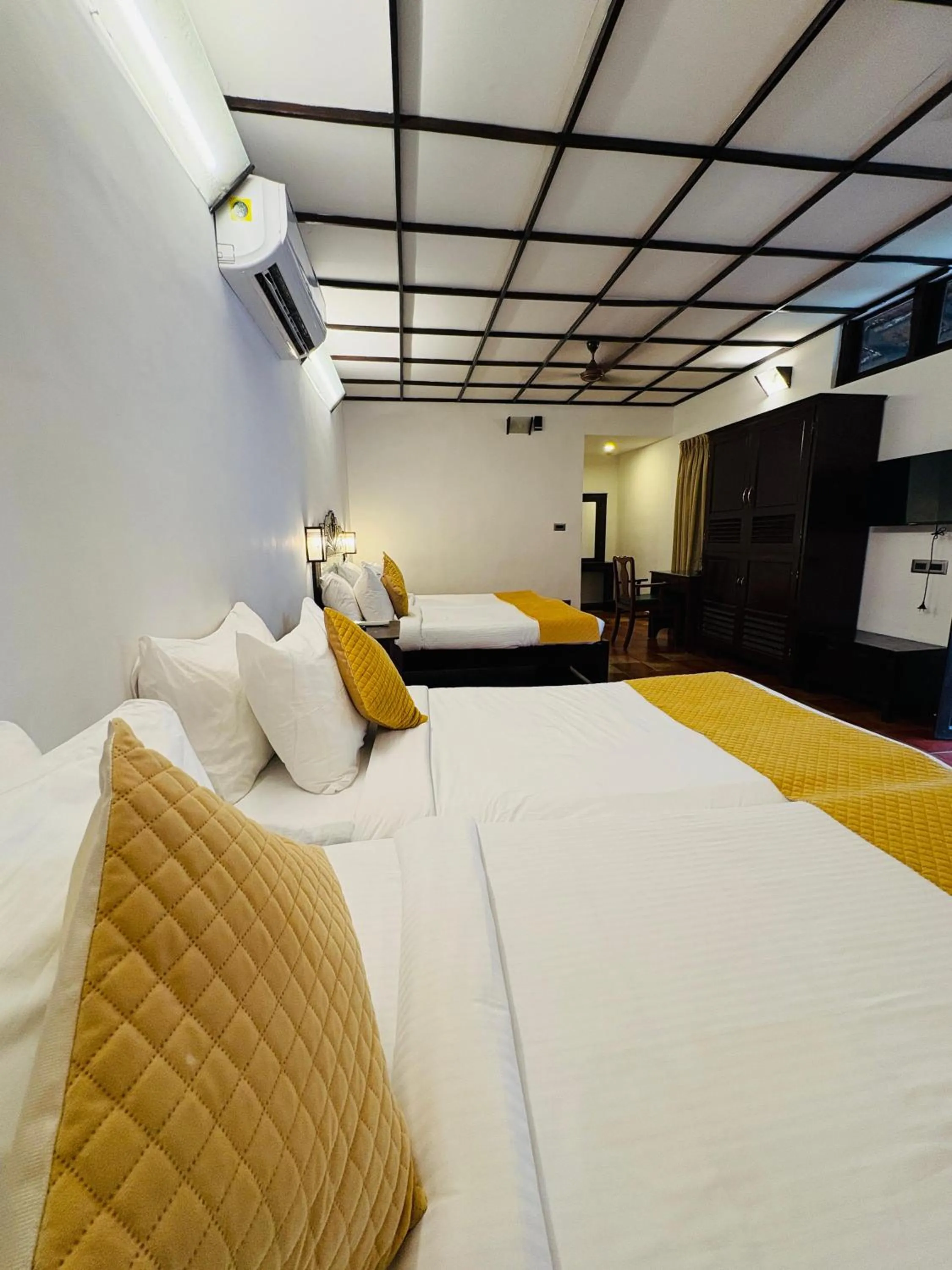 Bedroom, Bed in Kumarakom Tharavadu - A Heritage Hotel, Kumarakom By Perfect Stays