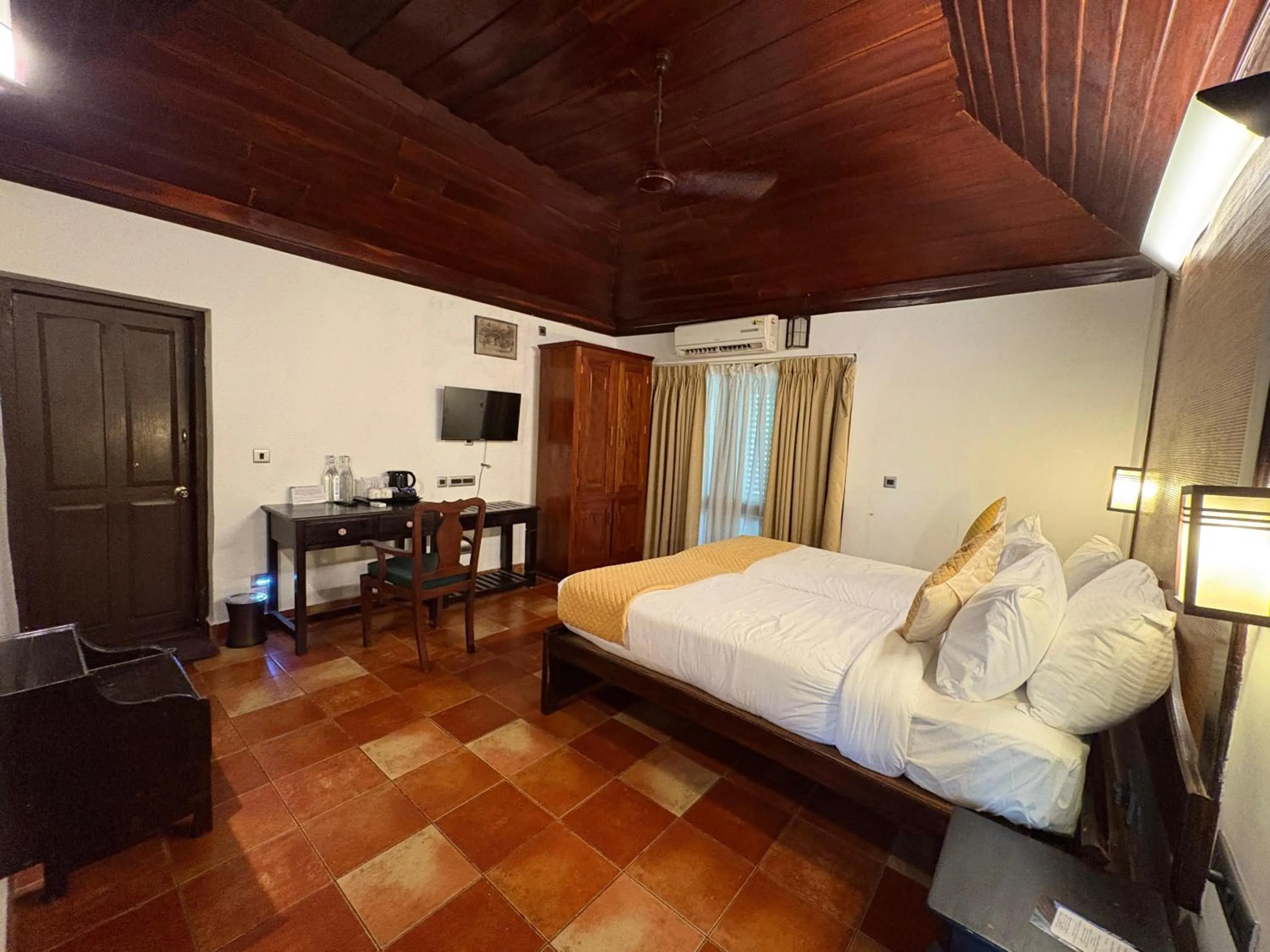 Bedroom, Bed in Kumarakom Tharavadu - A Heritage Hotel, Kumarakom By Perfect Stays