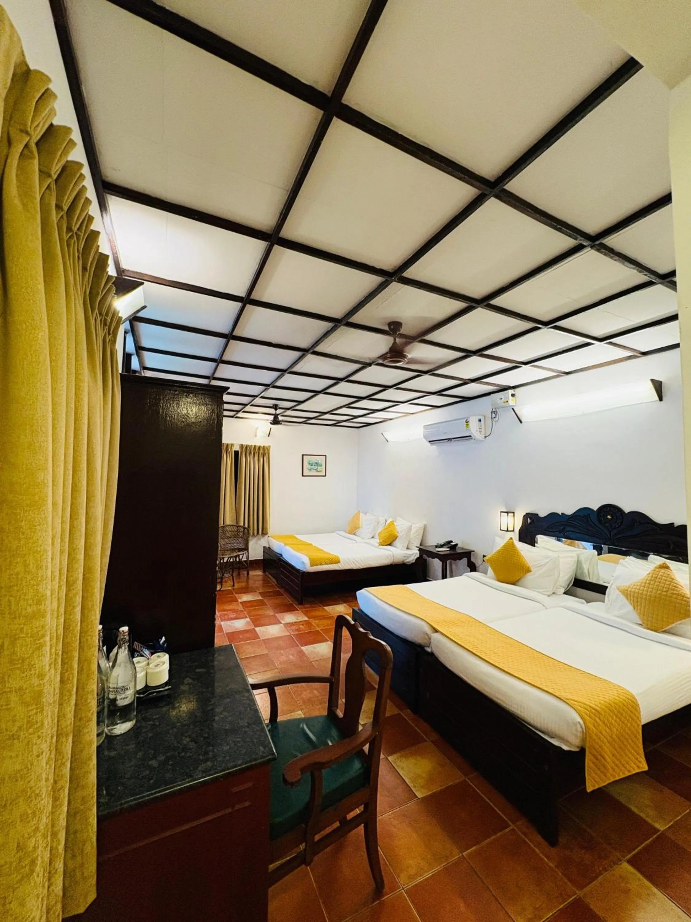 Bedroom, Bed in Kumarakom Tharavadu - A Heritage Hotel, Kumarakom By Perfect Stays