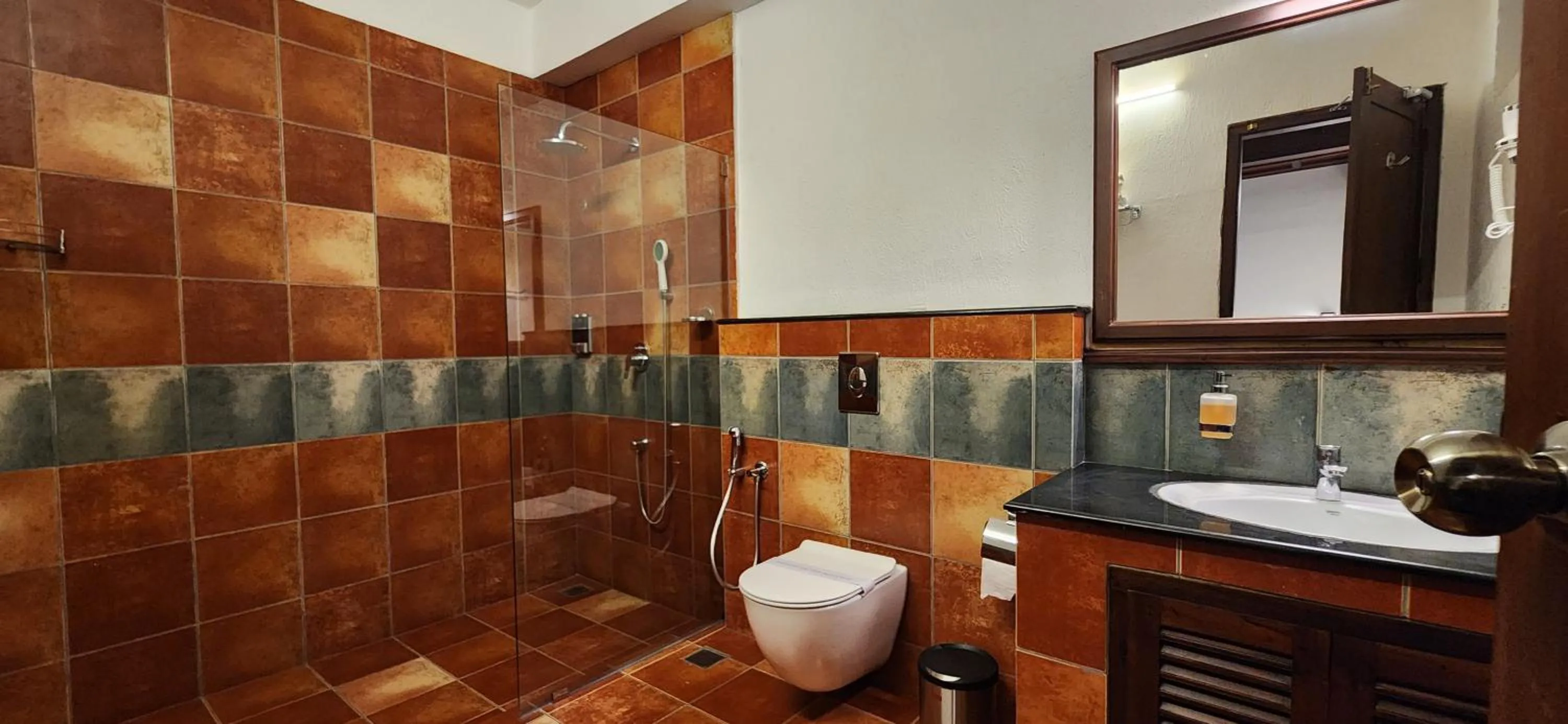 Shower in Kumarakom Tharavadu - A Heritage Hotel, Kumarakom By Perfect Stays