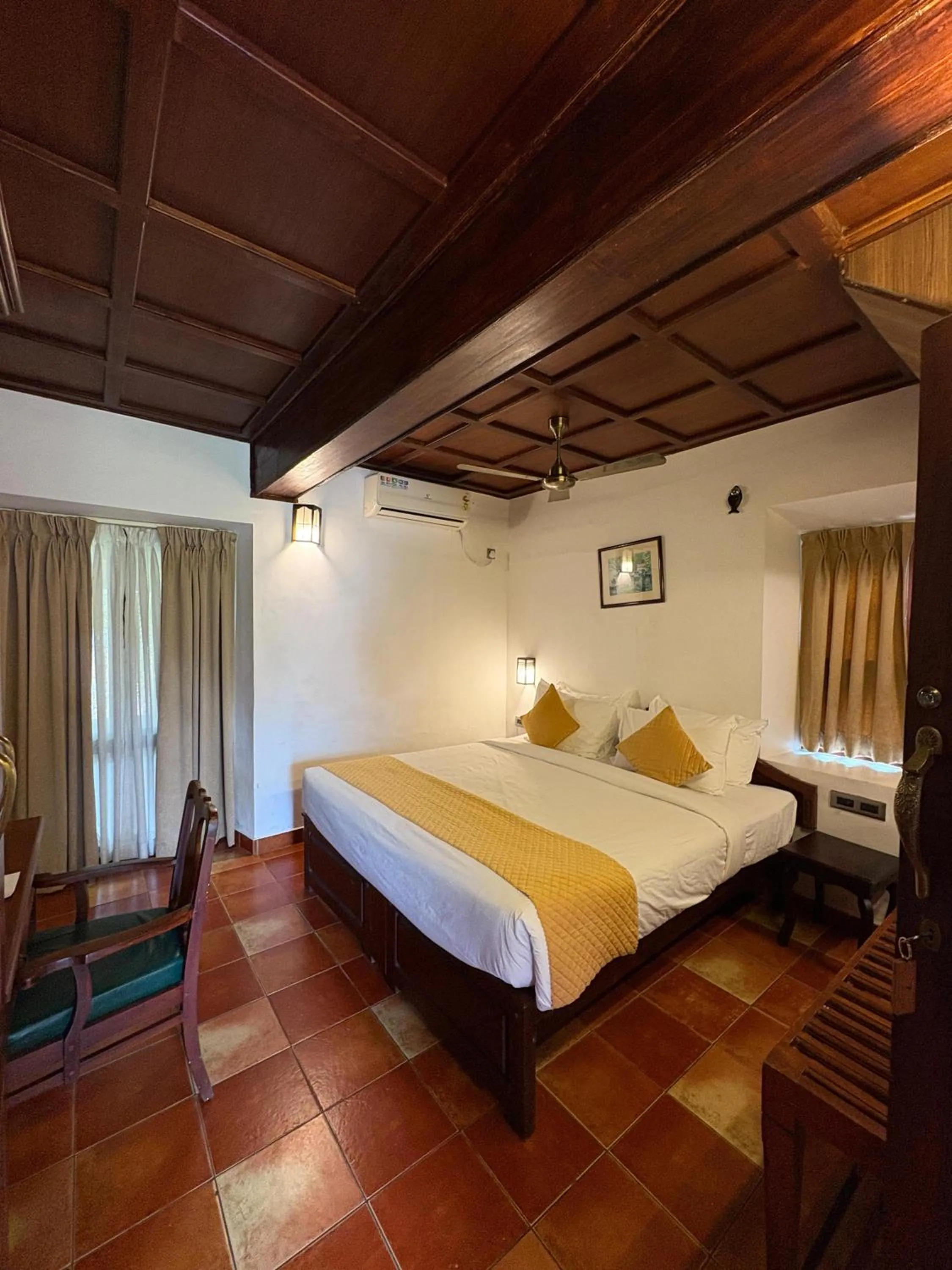 Bedroom, Bed in Kumarakom Tharavadu - A Heritage Hotel, Kumarakom By Perfect Stays