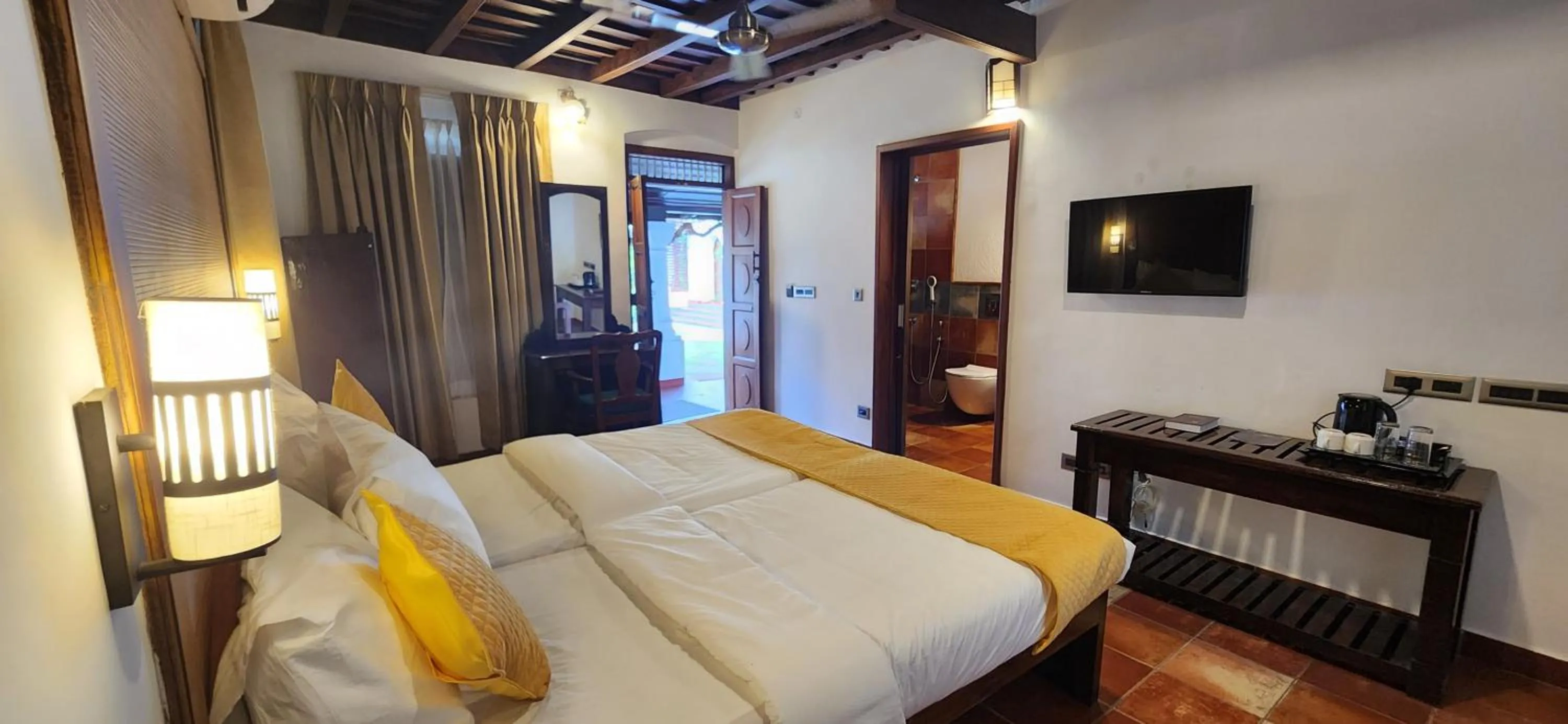 TV and multimedia, Bed in Kumarakom Tharavadu - A Heritage Hotel, Kumarakom By Perfect Stays