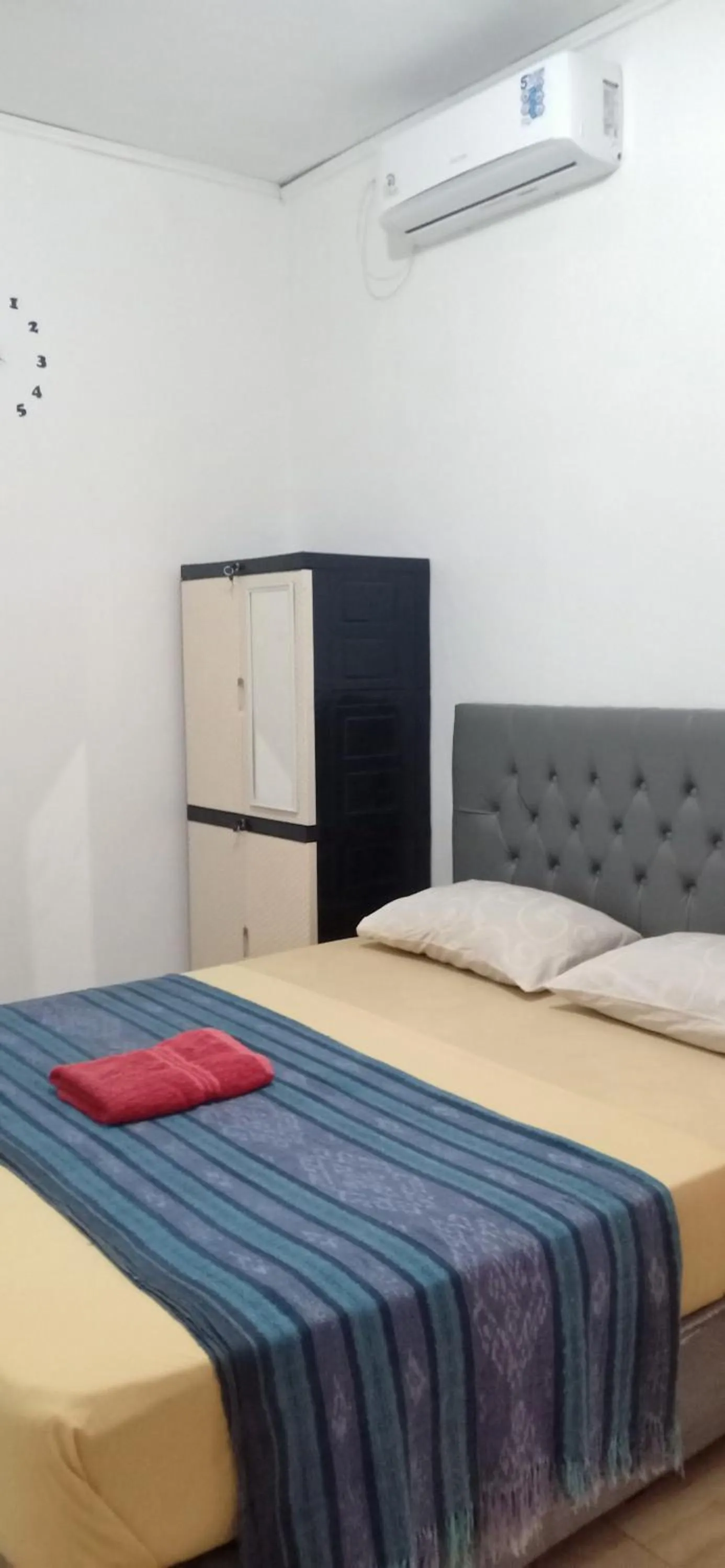 Bed in Dewi Garden Guesthouse