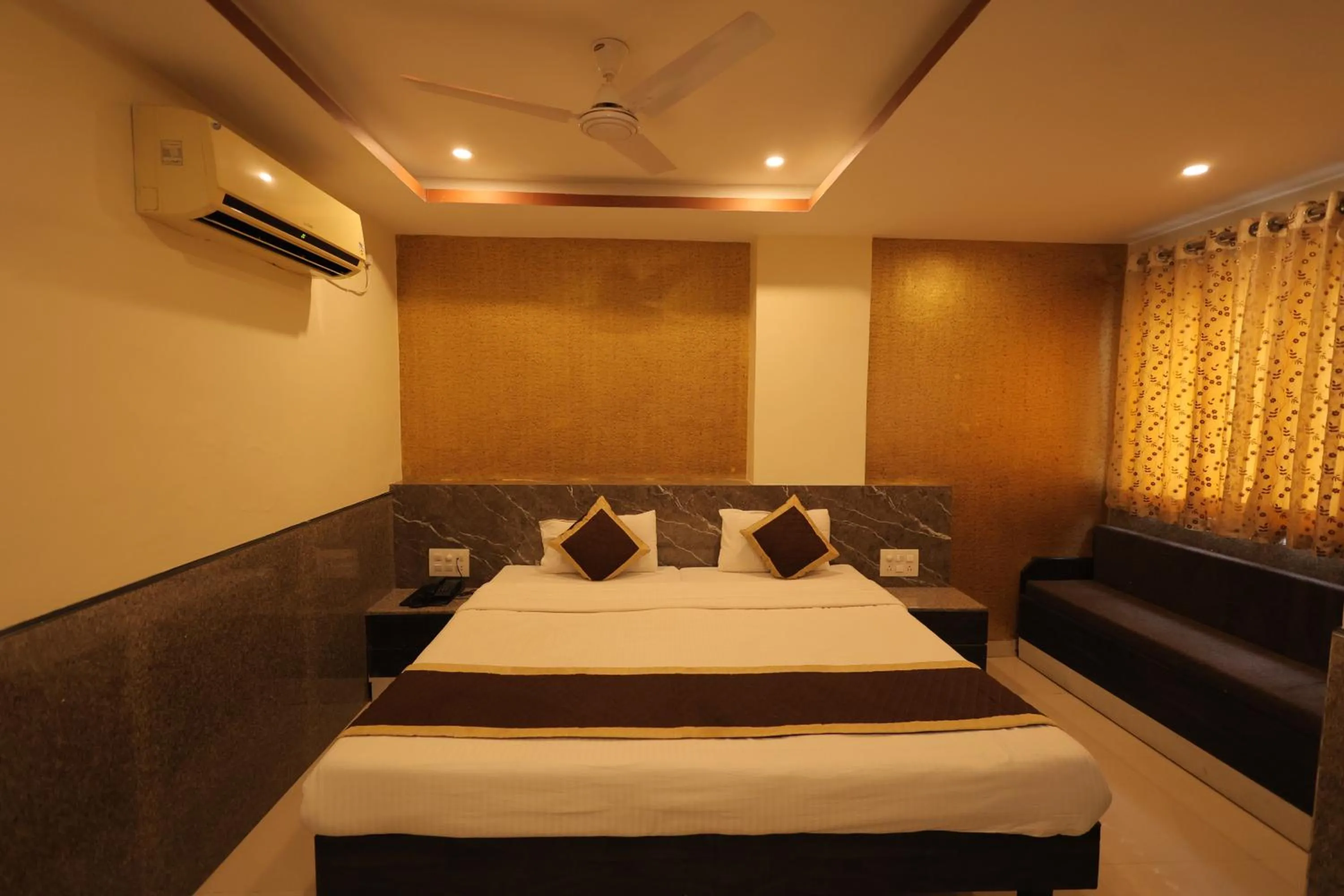 Bed in Nakshatra Hotel