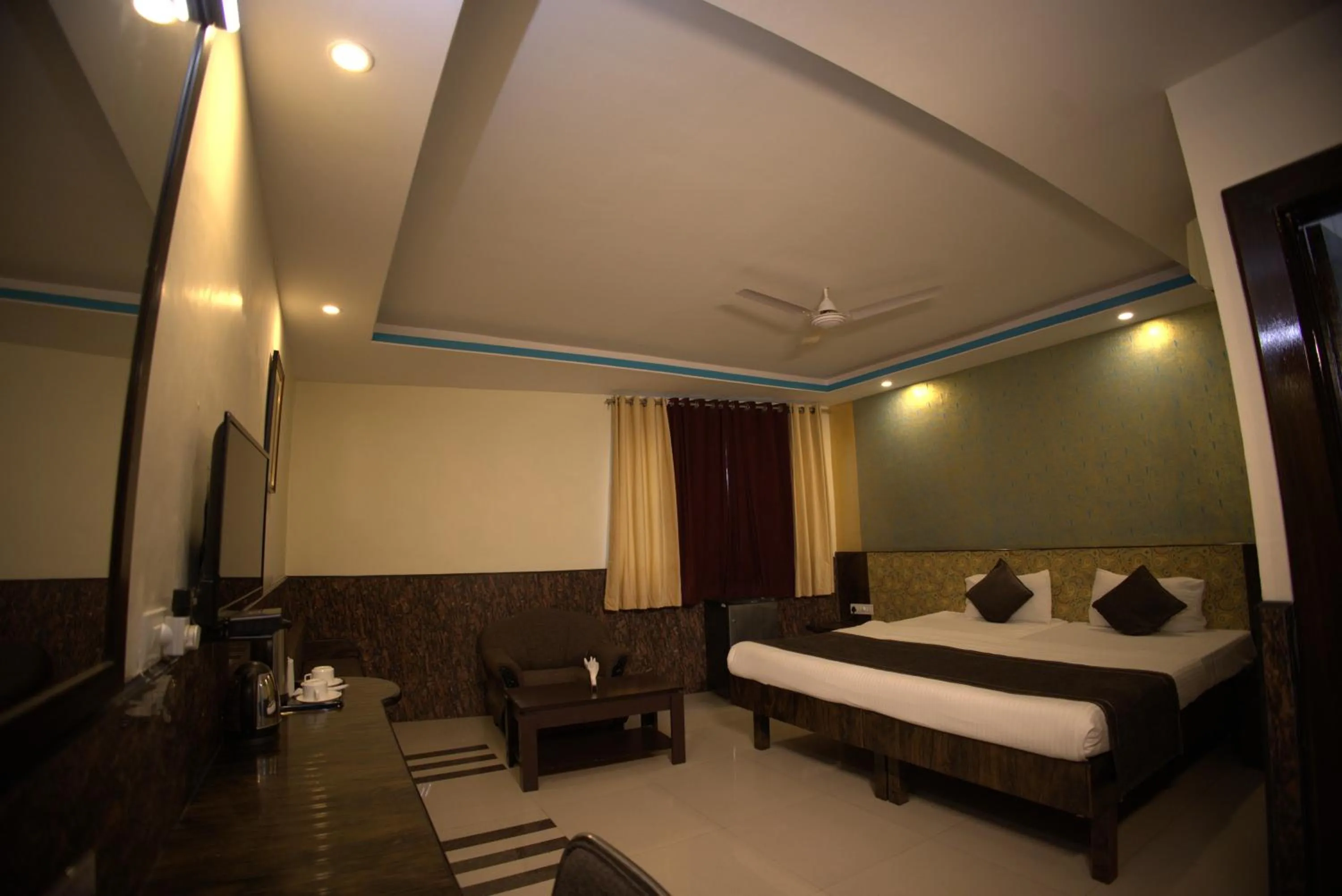Bed in Nakshatra Hotel
