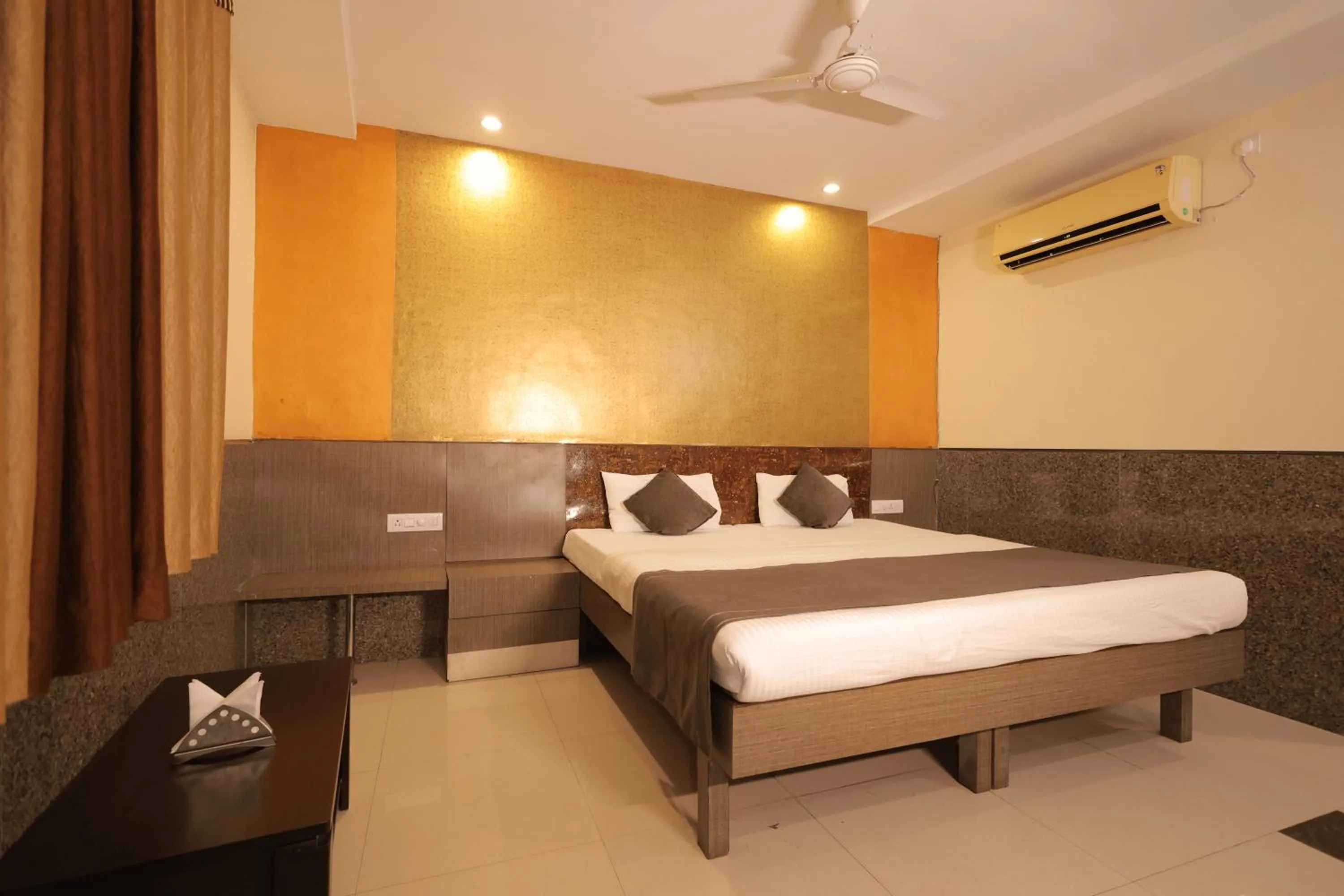 Bed in Nakshatra Hotel