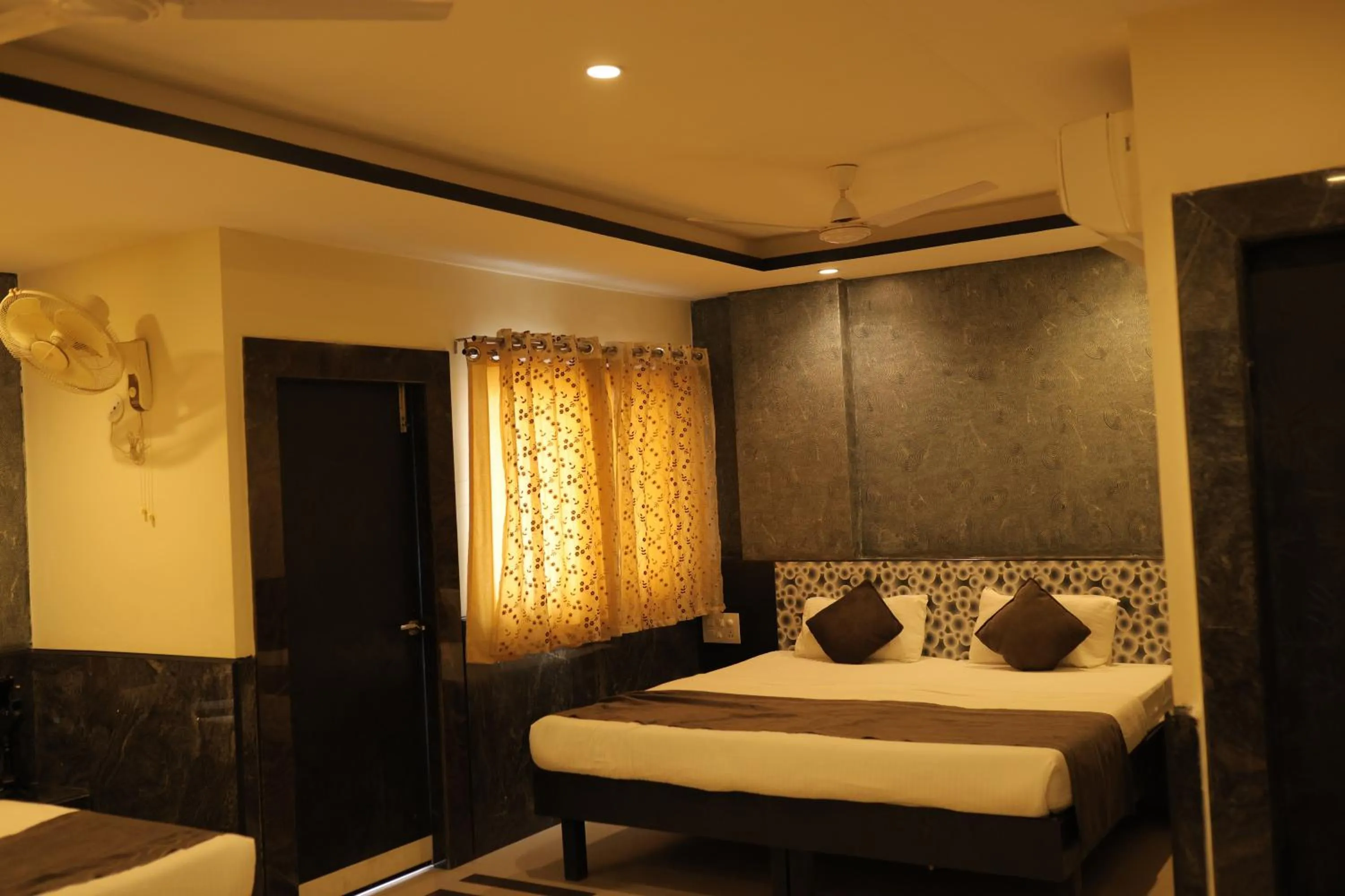 Bed in Nakshatra Hotel