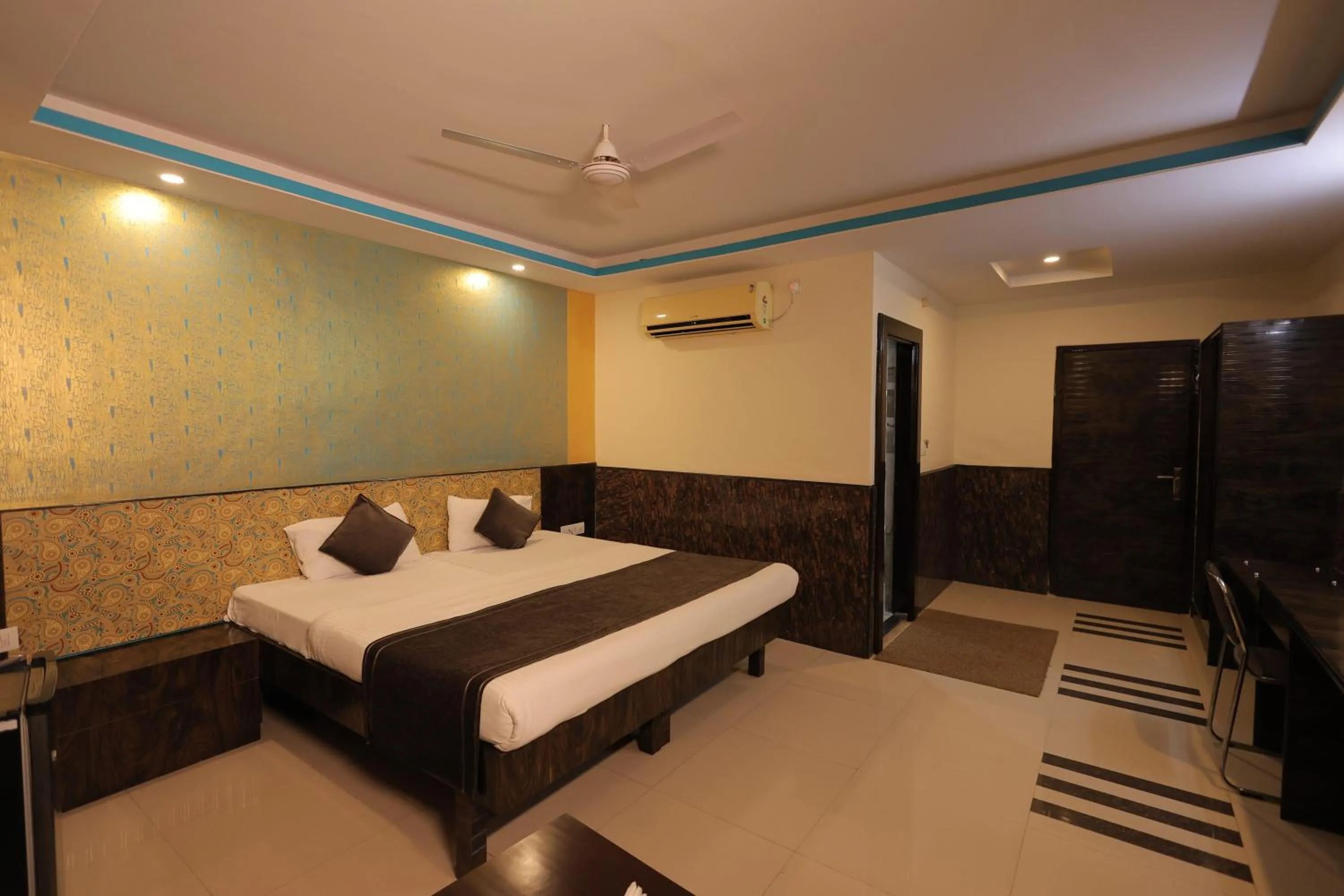 Bed in Nakshatra Hotel