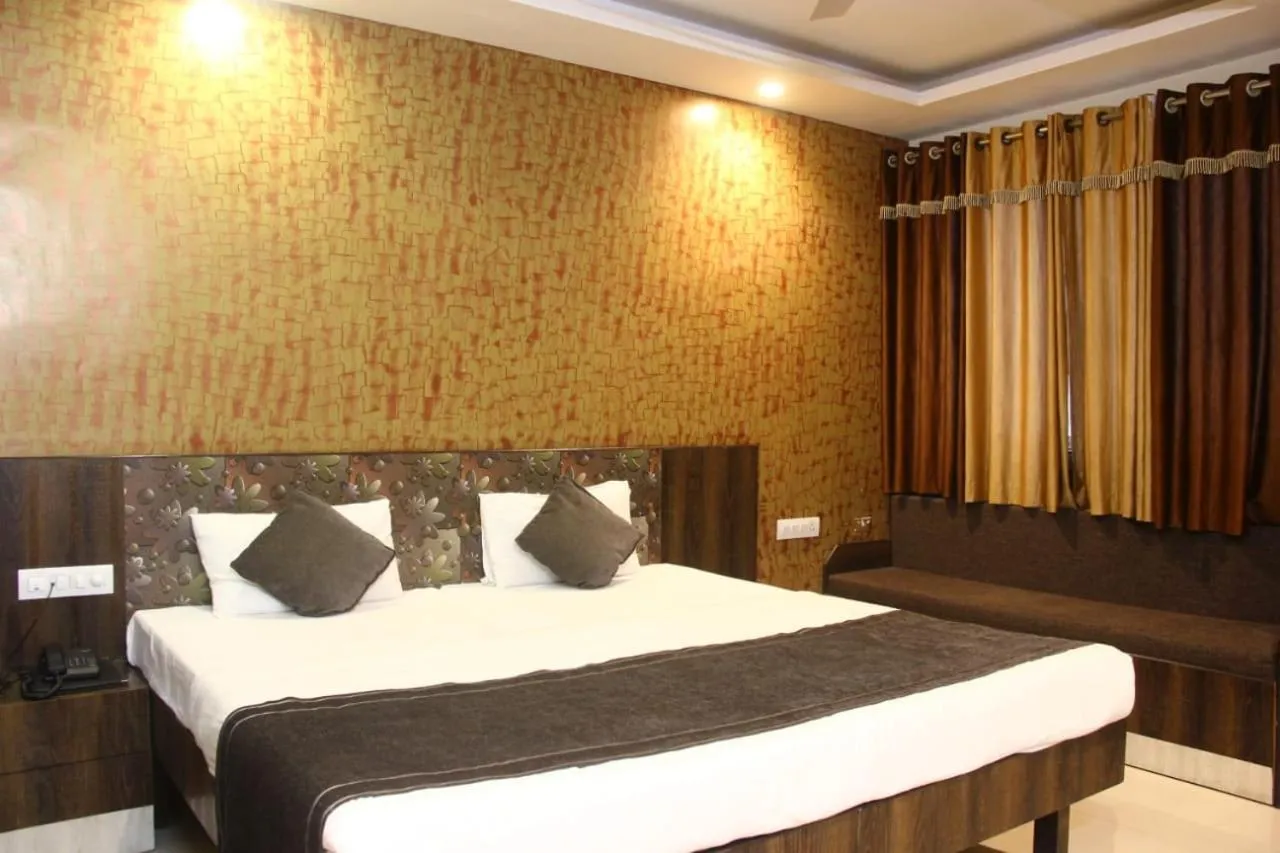 Bed in Nakshatra Hotel