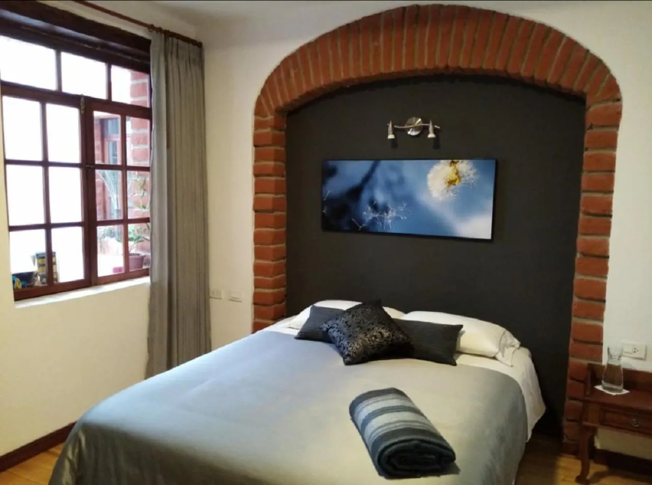 Bed in Hotel Casa Ecuatreasures Centro Historico