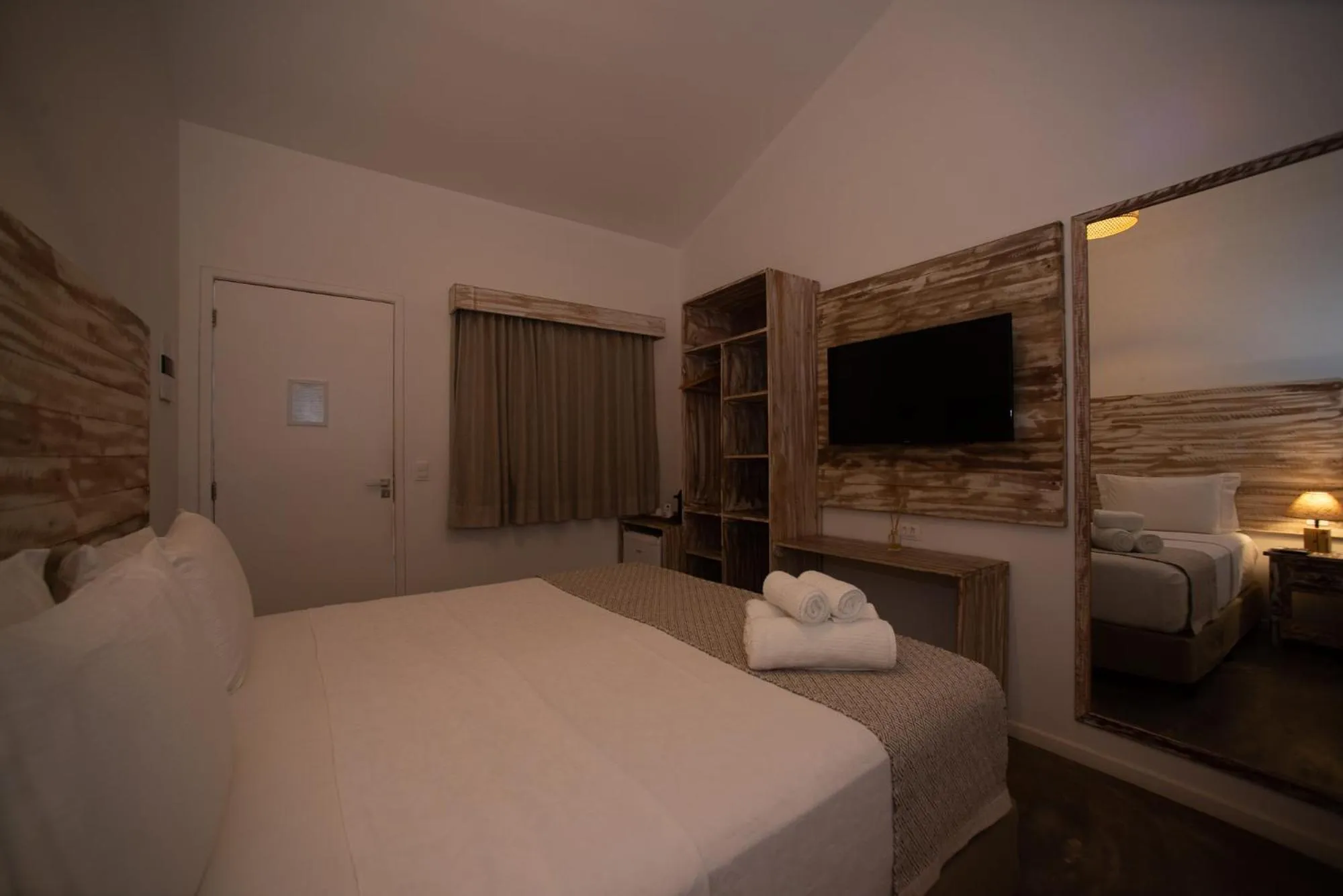 Bed in Pousada Tubarão