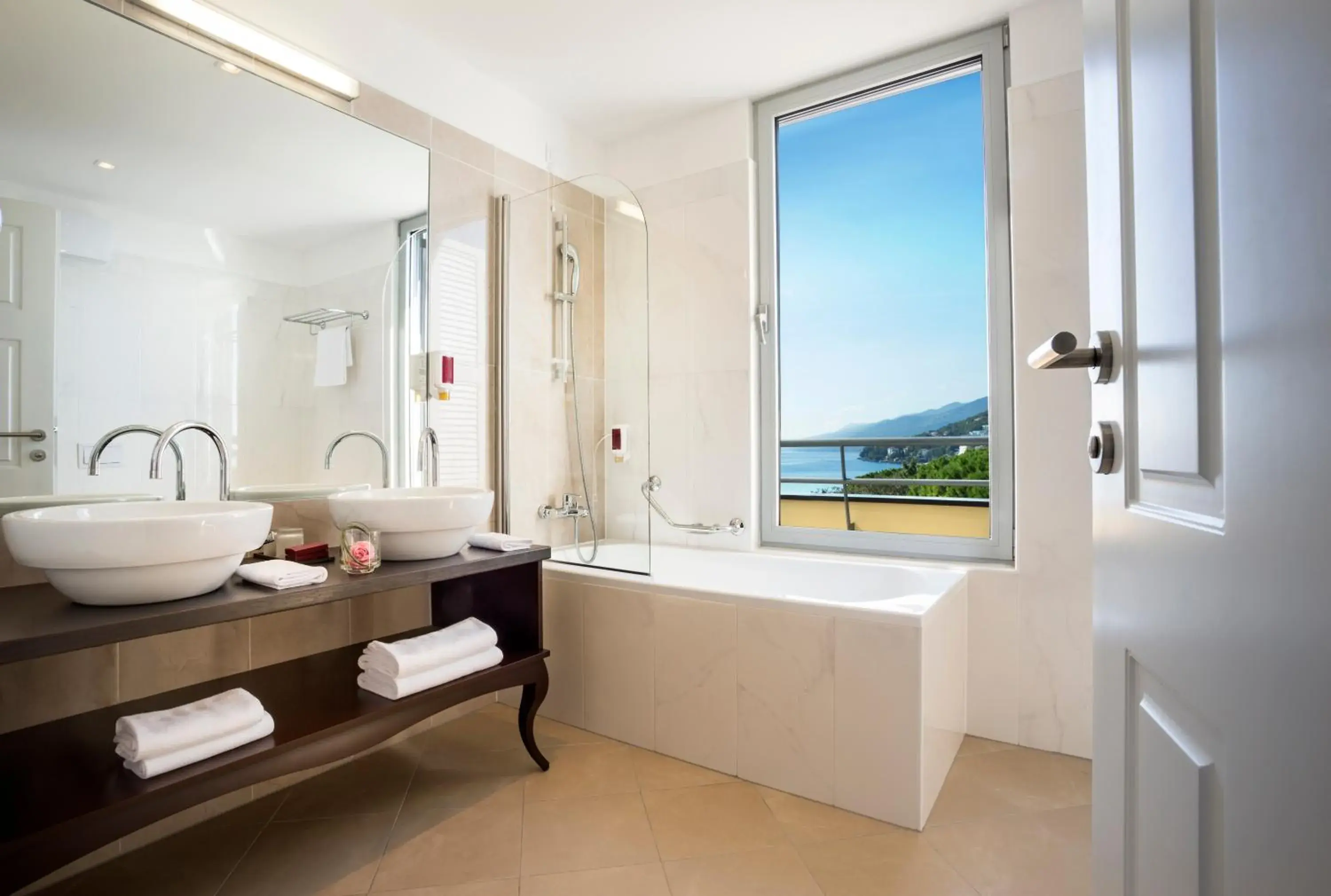 Bathroom in Hotel Kvarner - by Liburnia Hotels & Villas Bathroom in Hotel Kvarner - by Liburnia Hotels & Villas