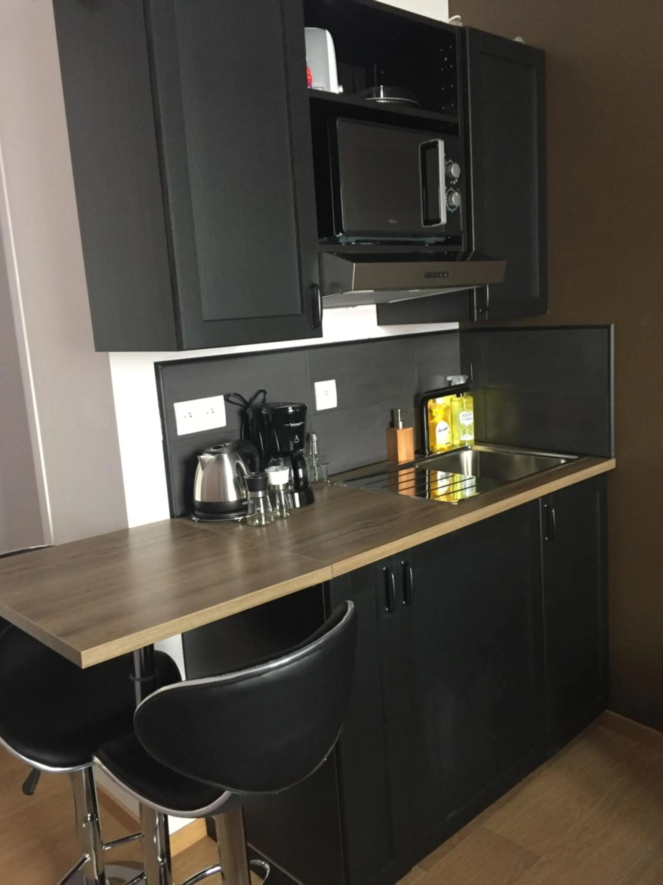 Kitchen or kitchenette in Appart'hôtel et chambres Lens