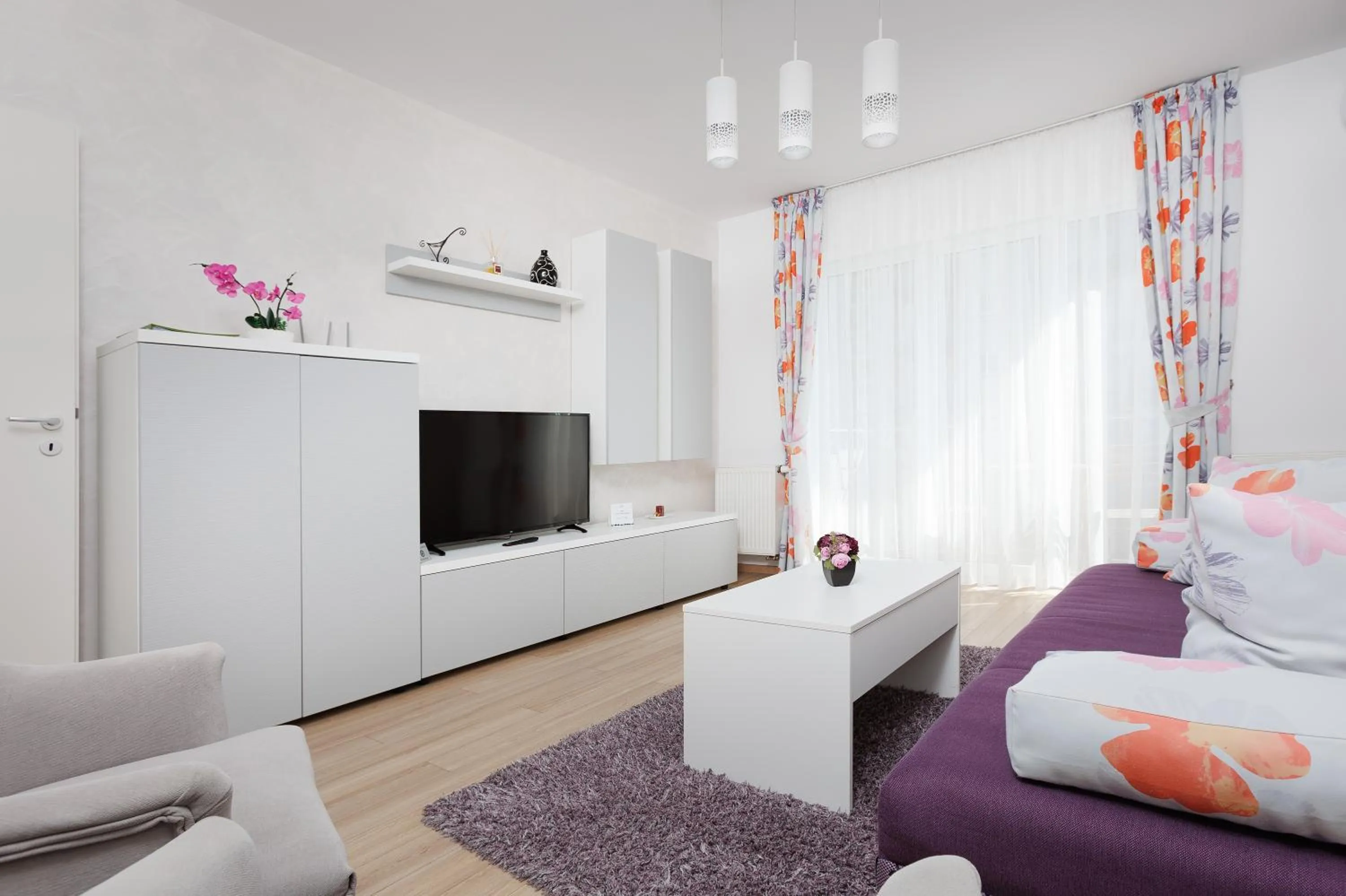 Communal lounge/ TV room, Bed in Brasov Holiday Apartments
